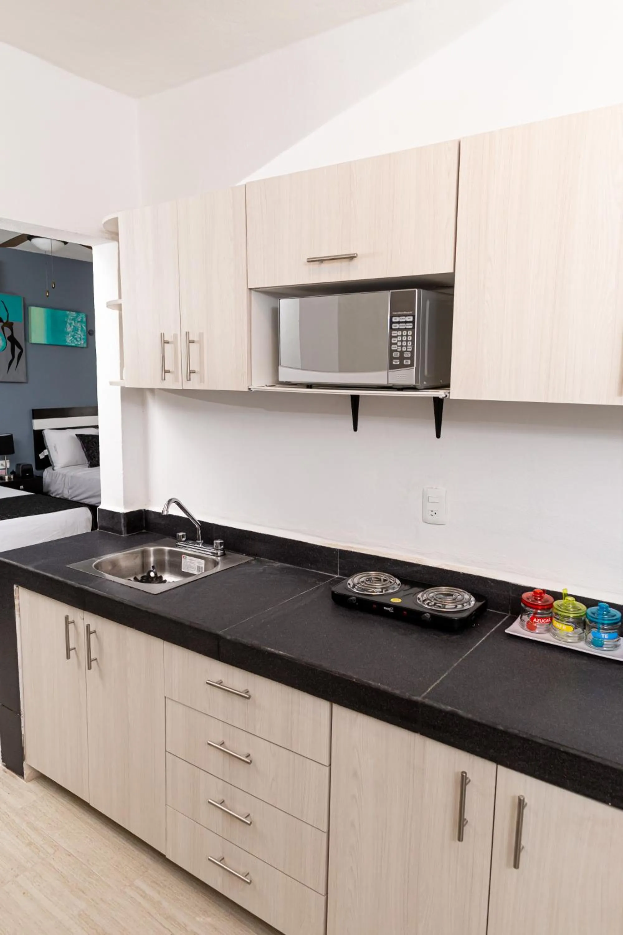 Kitchen or kitchenette in Santa Fe Studios And Suites