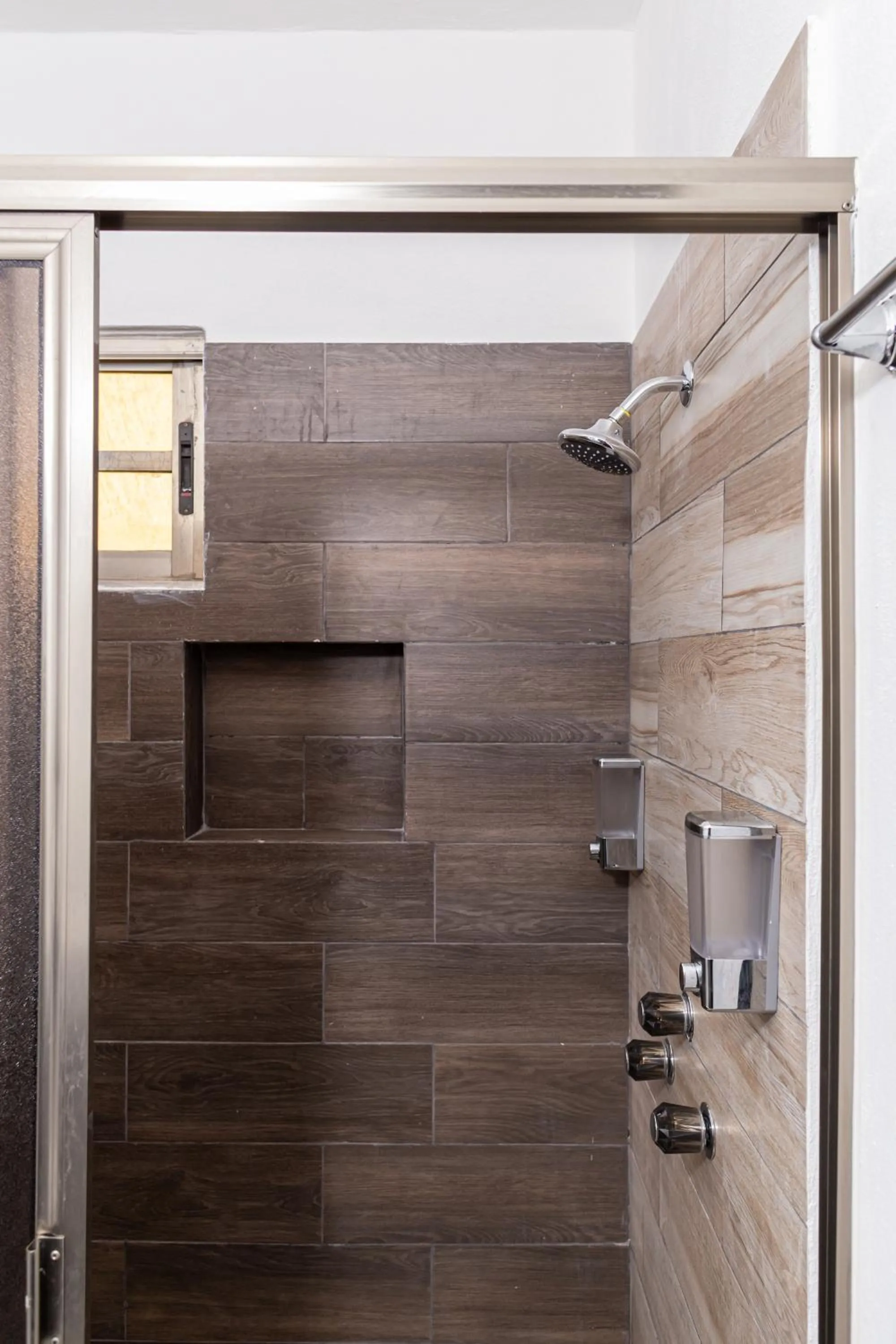 Shower in Santa Fe Studios And Suites