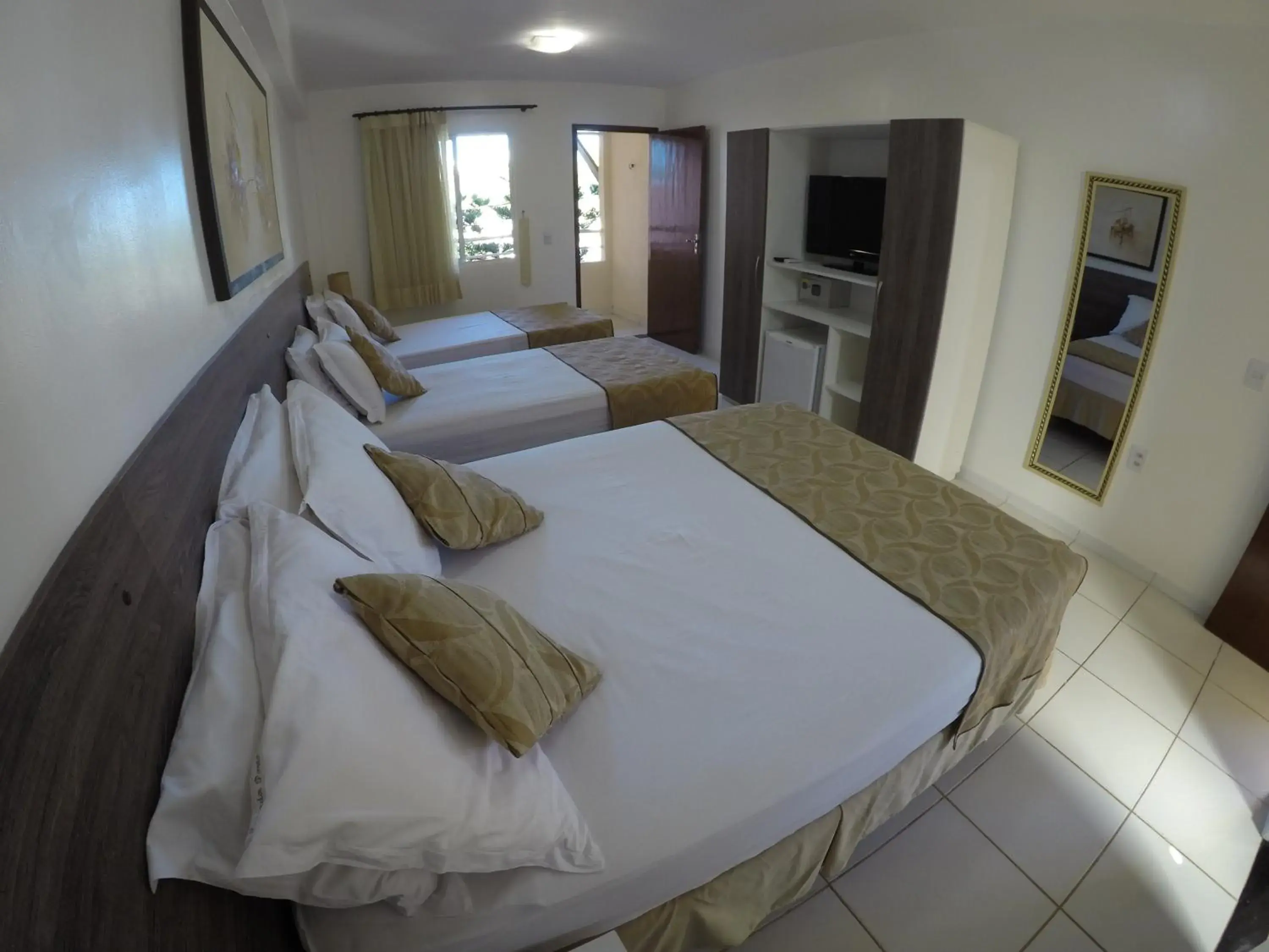 Standard Quadruple Room in Pousada Porto das Dunas Standard Quadruple Room in Pousada Porto das Dunas