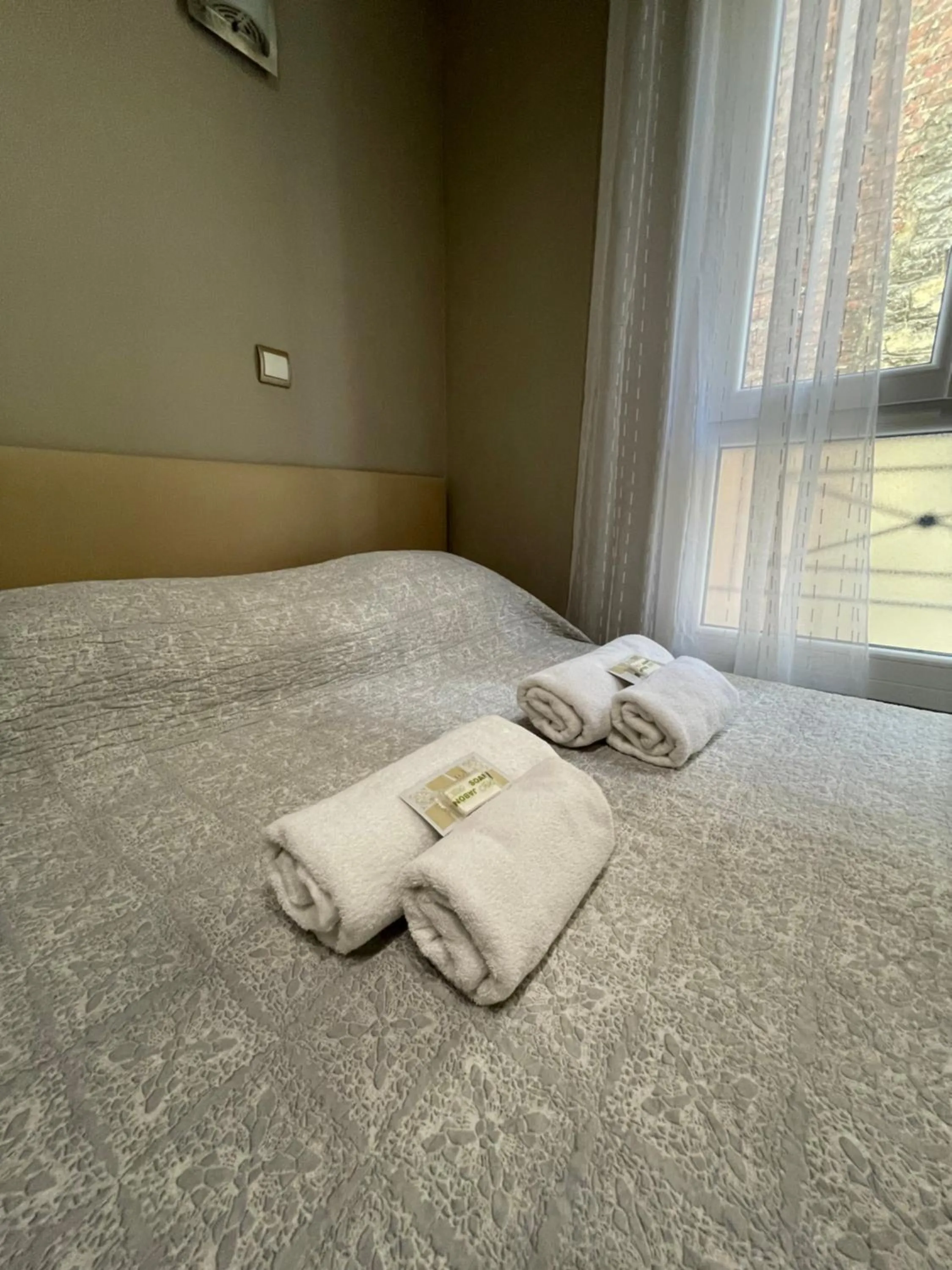 Bed in Hôtel de l'Aveyron