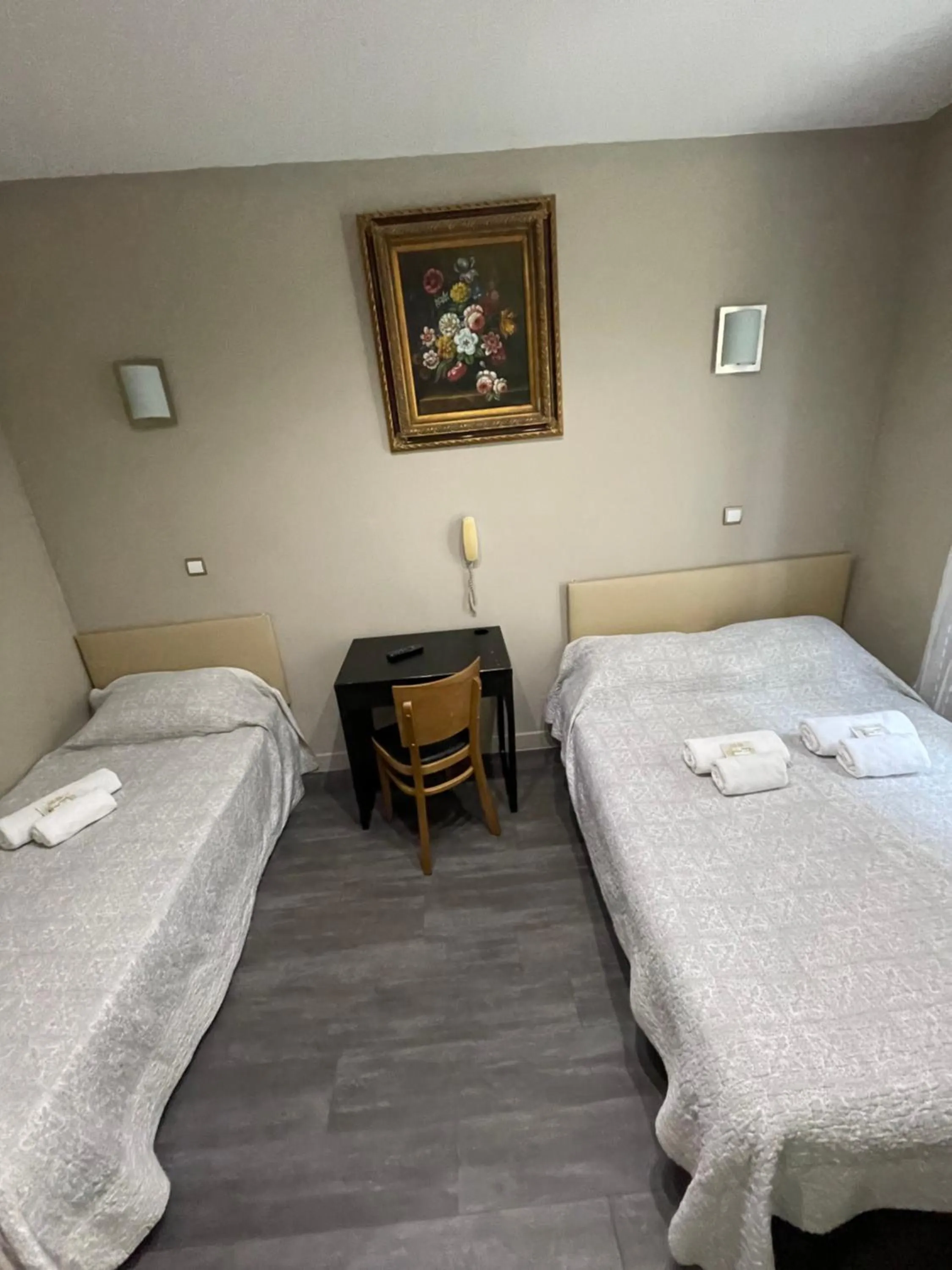 Bed in Hôtel de l'Aveyron