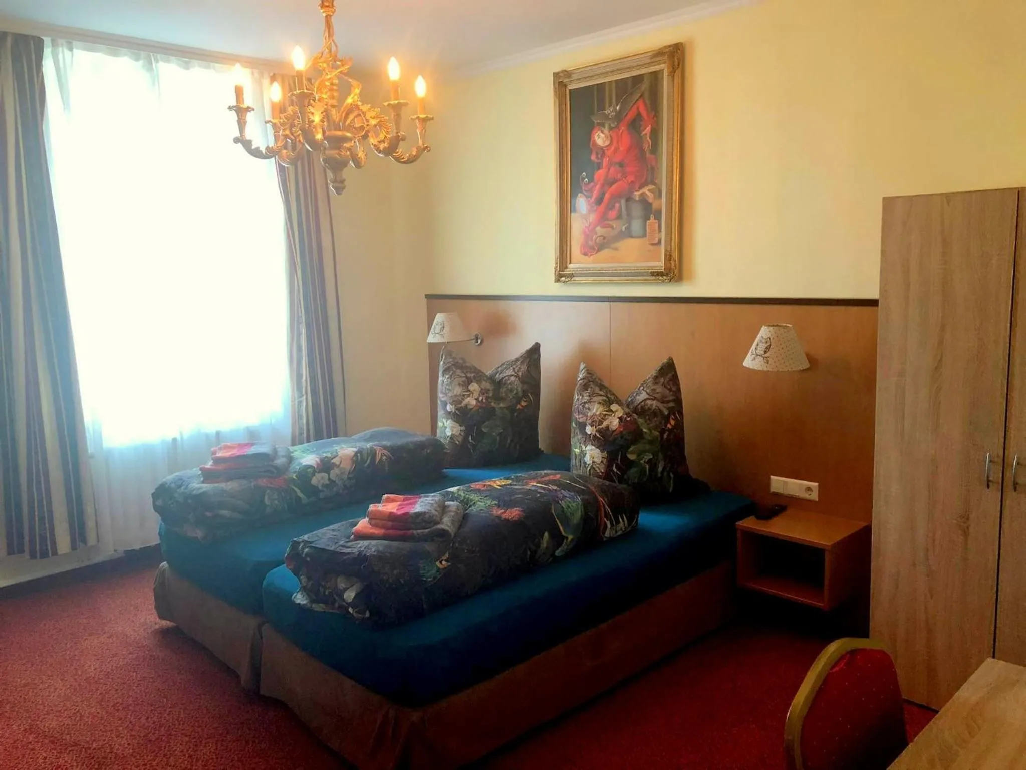 Bed in Hotel Eulenspiegel - Das Erlebnishotel in Riesa