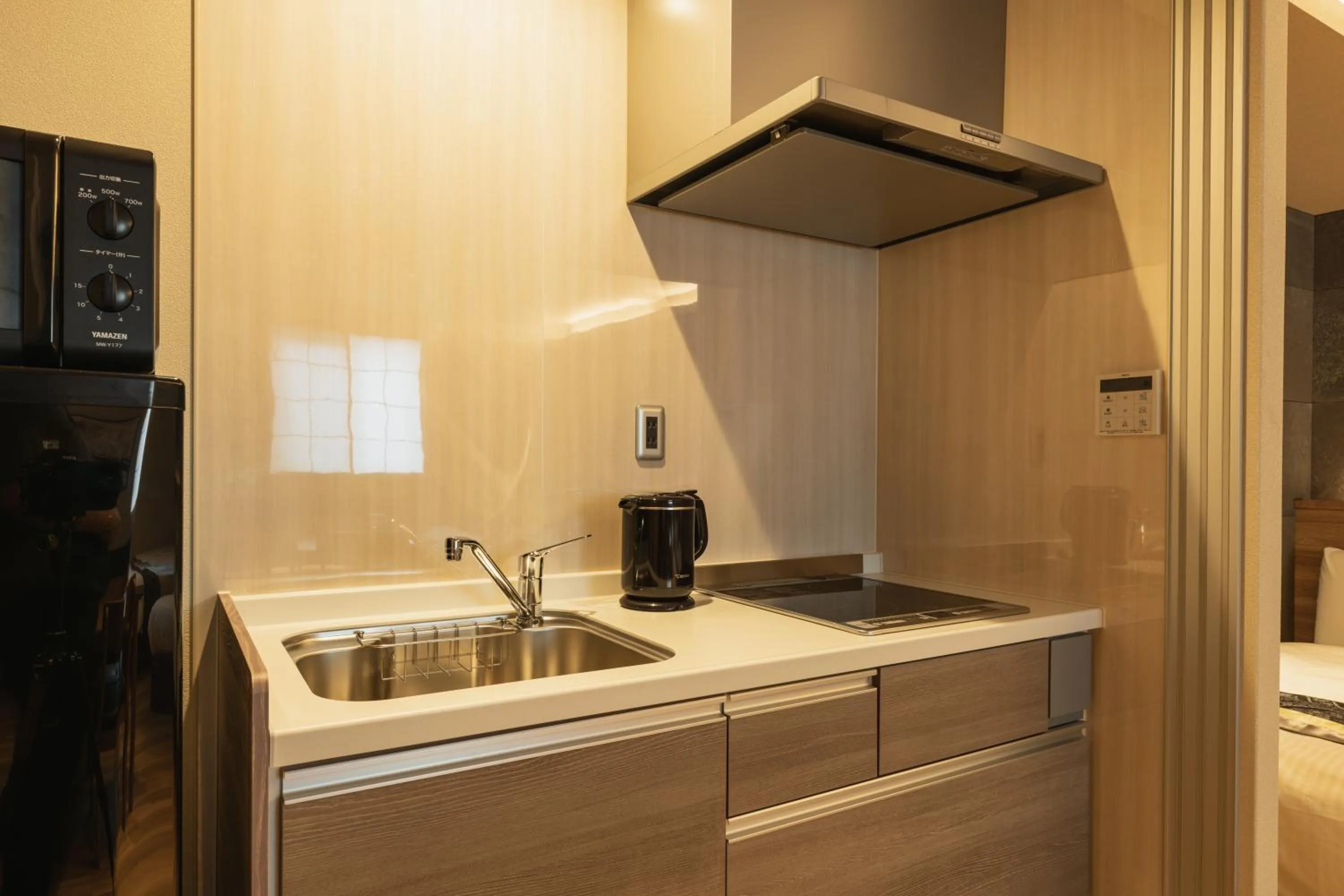 Kitchen or kitchenette in GRAND BASE Beppu