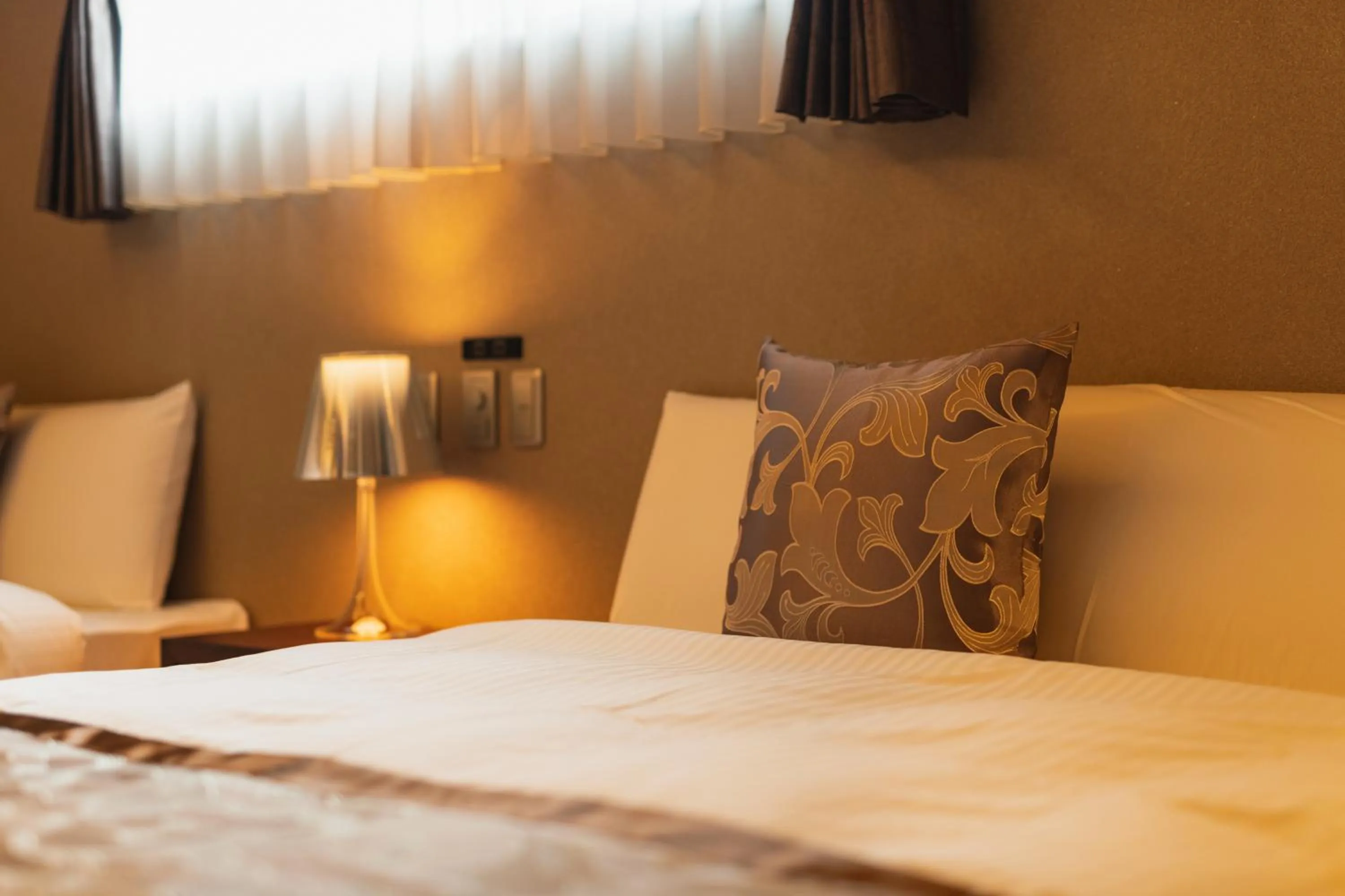 Bed in GRAND BASE Beppu