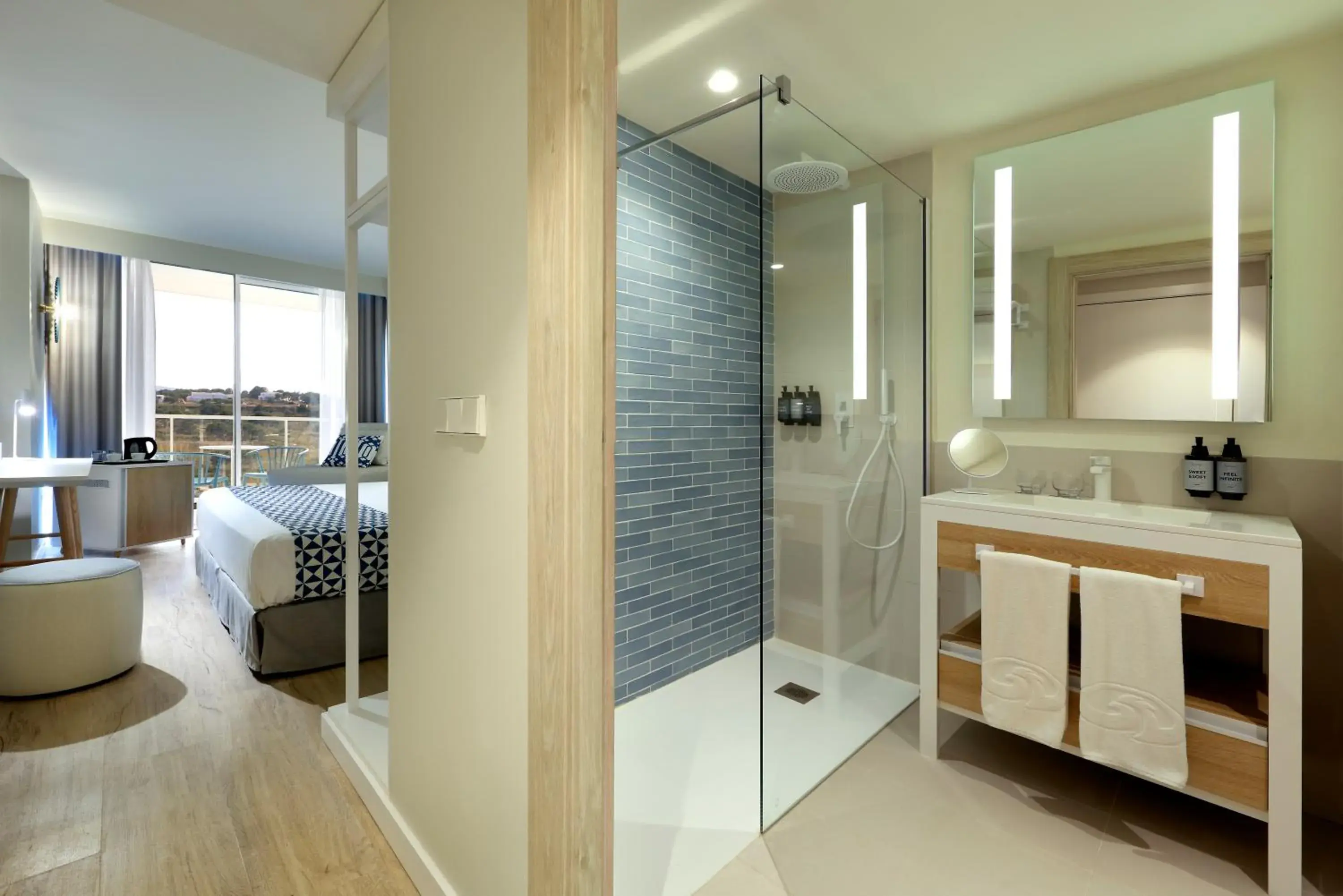 Shower, Bed in Palladium Hotel Menorca Shower, Bed in Palladium Hotel Menorca