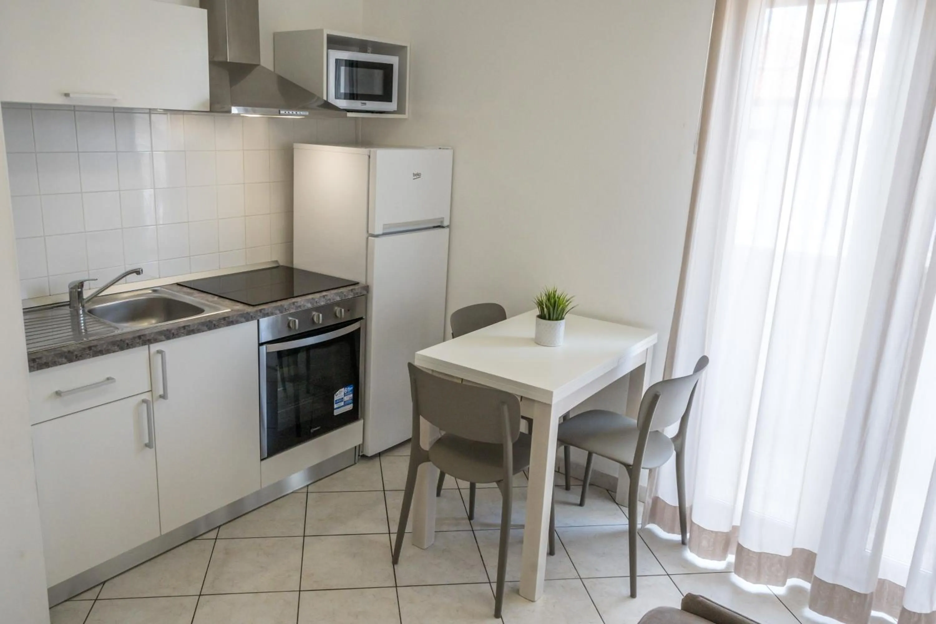 Kitchen or kitchenette in Rimini Bay Suites&Residence