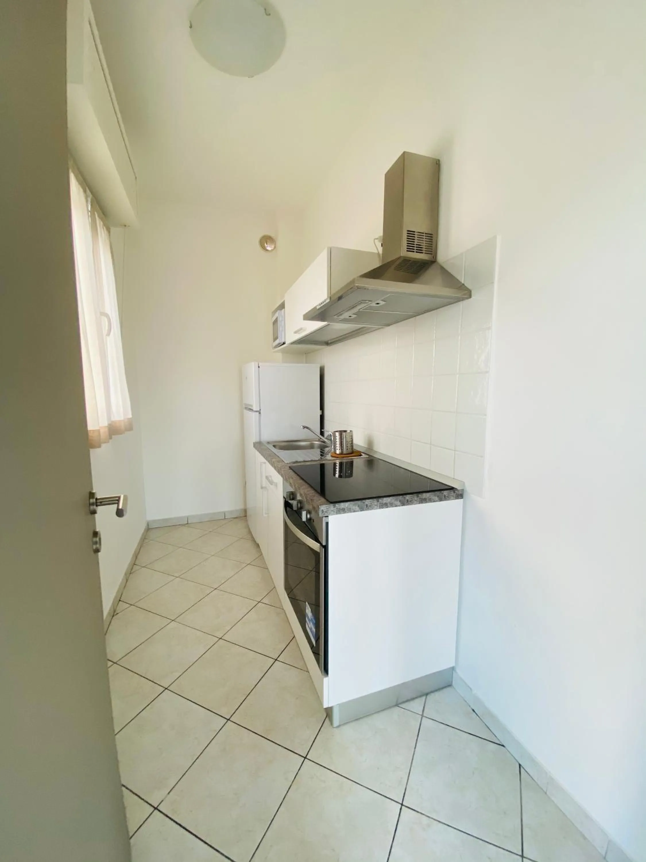 Kitchen or kitchenette in Rimini Bay Suites&Residence