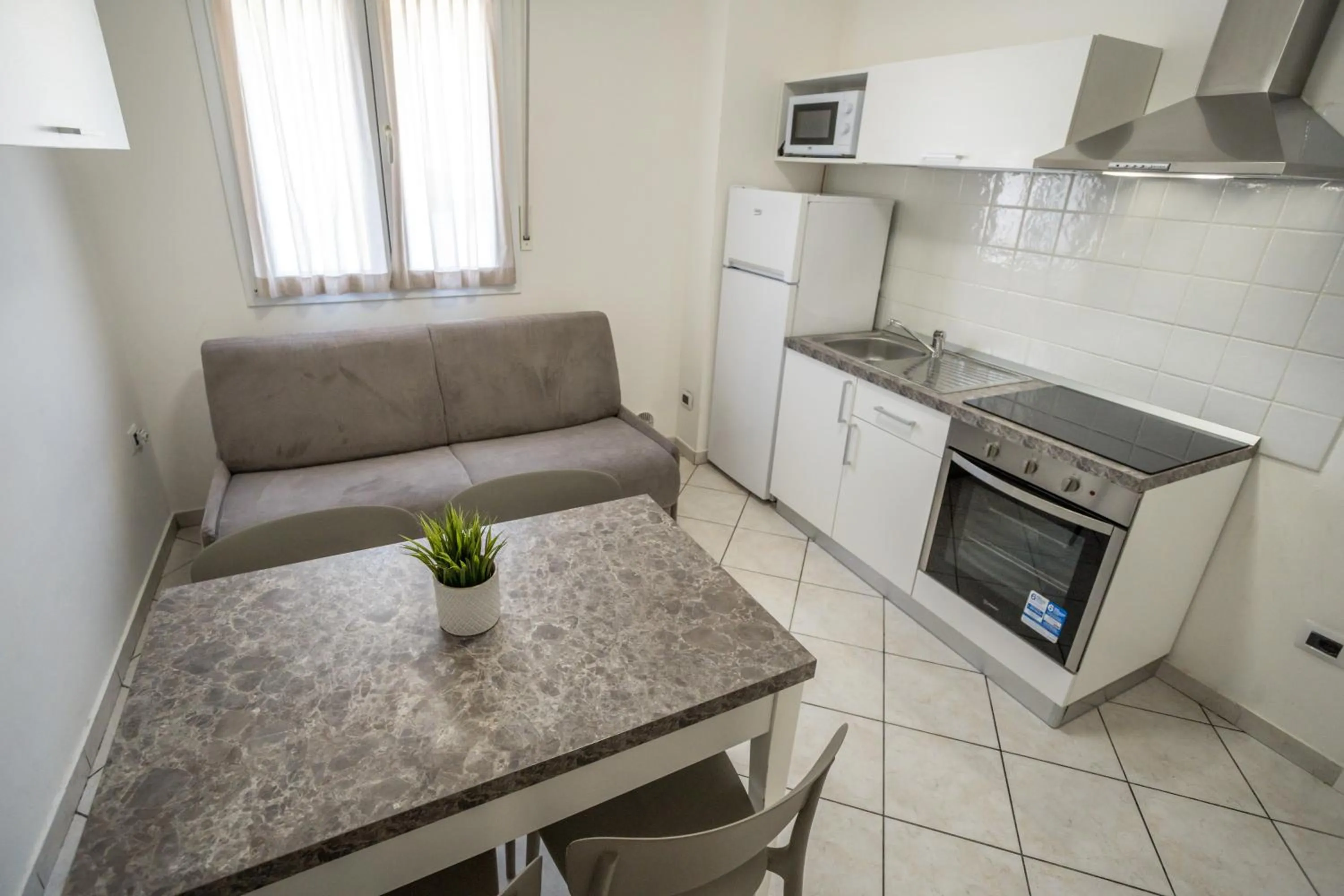 Kitchen or kitchenette in Rimini Bay Suites&Residence