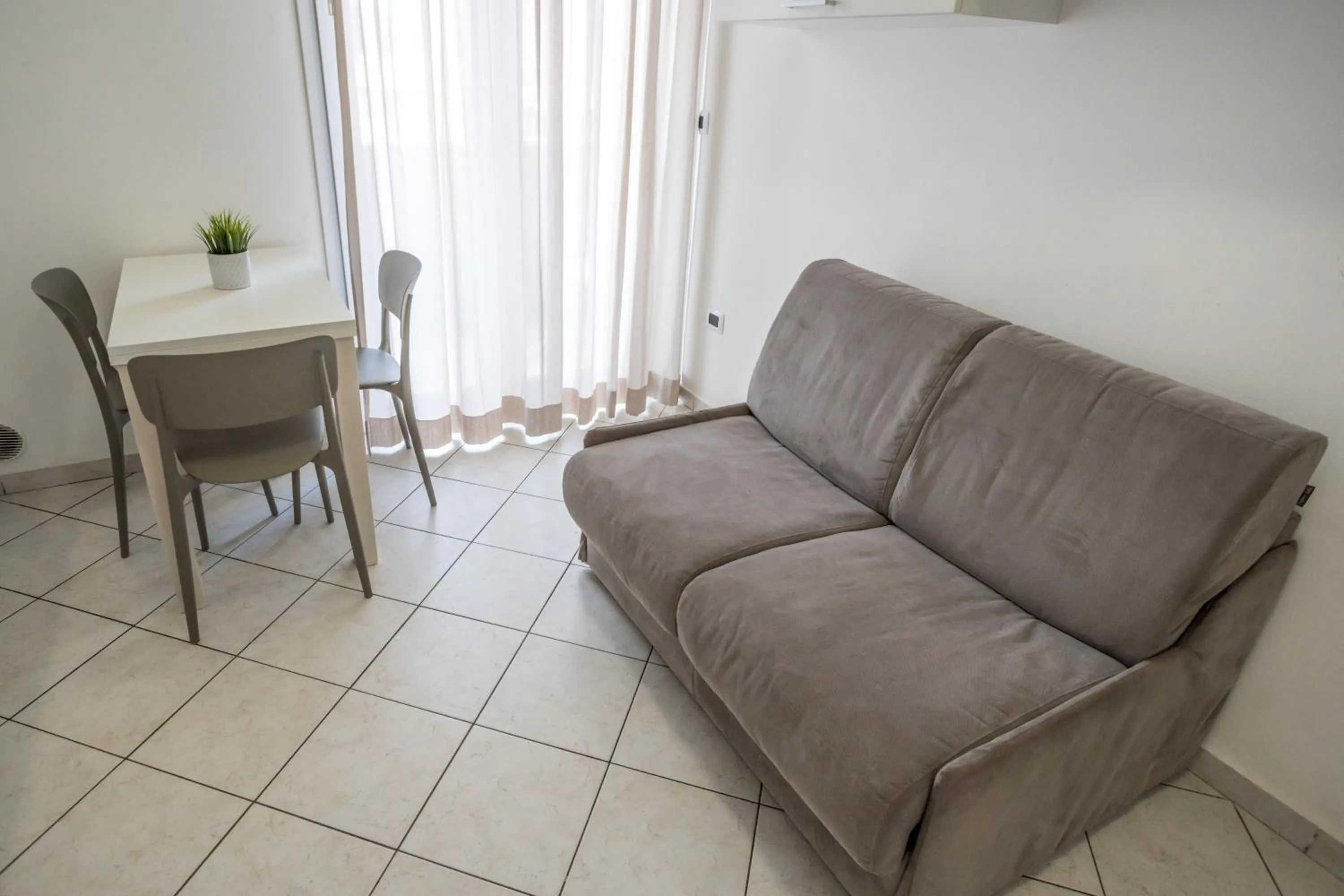 Seating area in Rimini Bay Suites&Residence