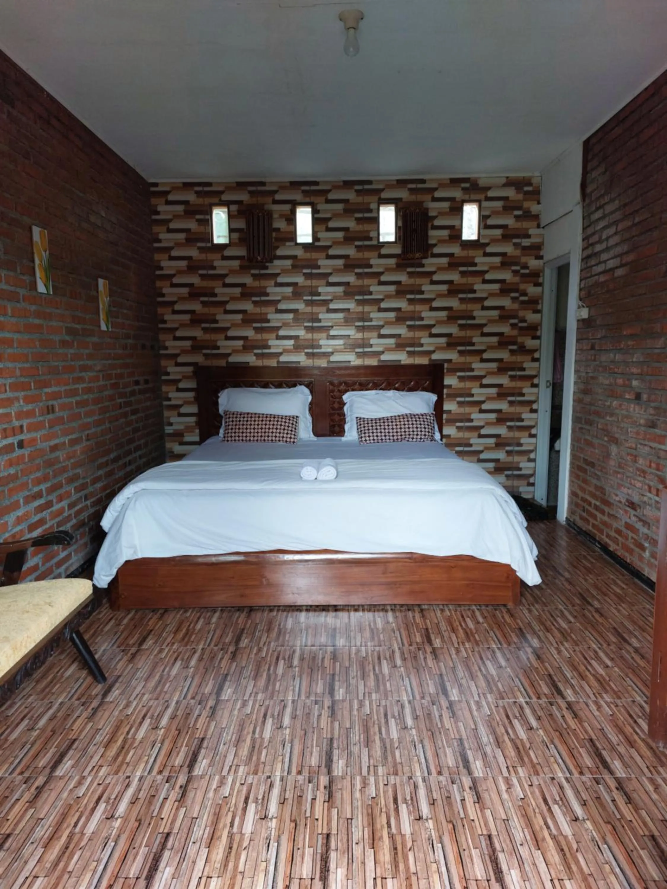 Bed in Bliss family cottage Batu