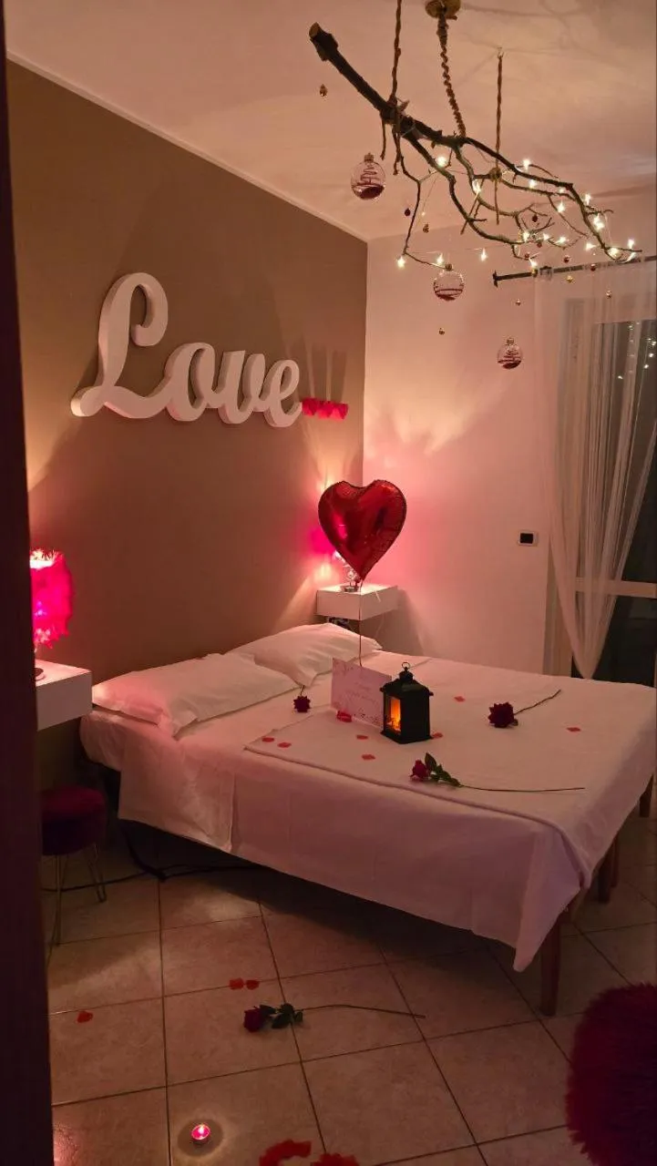 Bed in Andale SuiteSpa