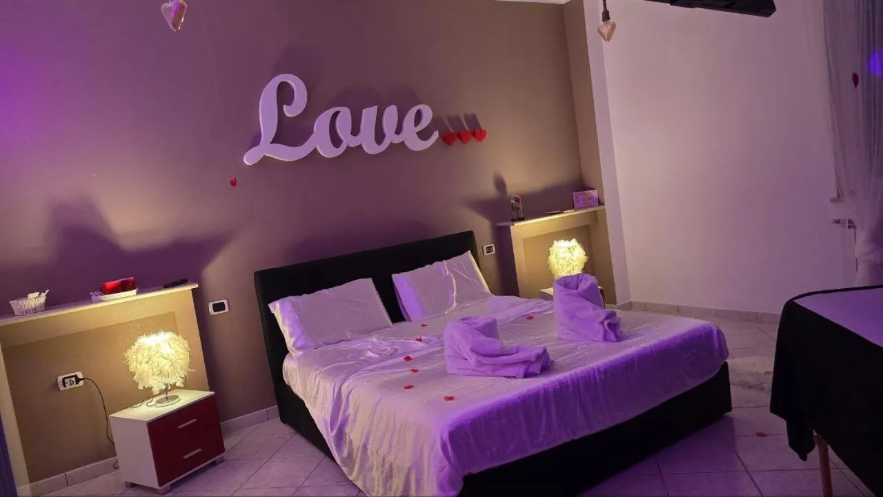 Bed in Andale SuiteSpa