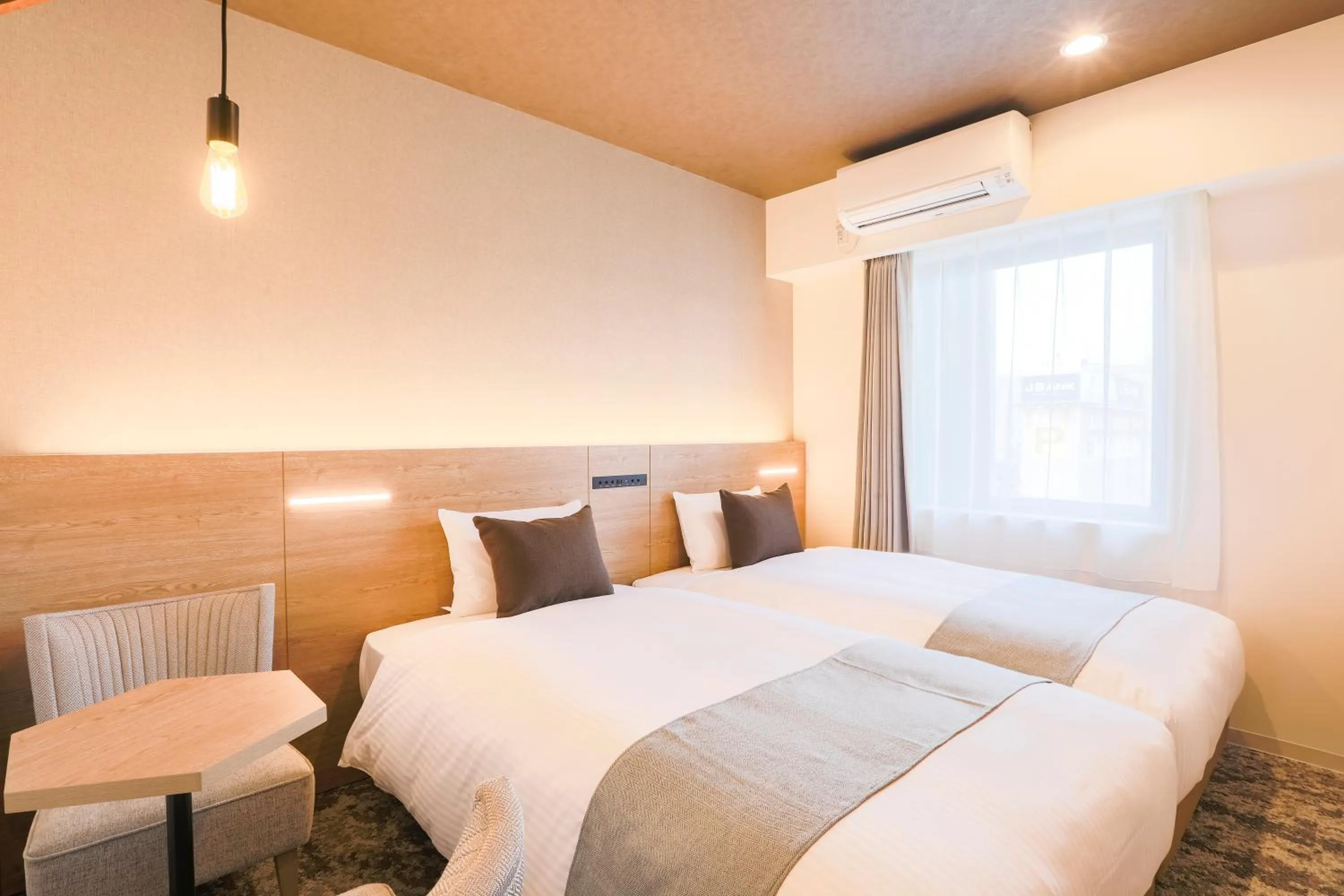 Photo of the whole room, Bed in KOKO HOTEL Sapporo Susukino - formerly Hotel Wing International Sapporo Susukino