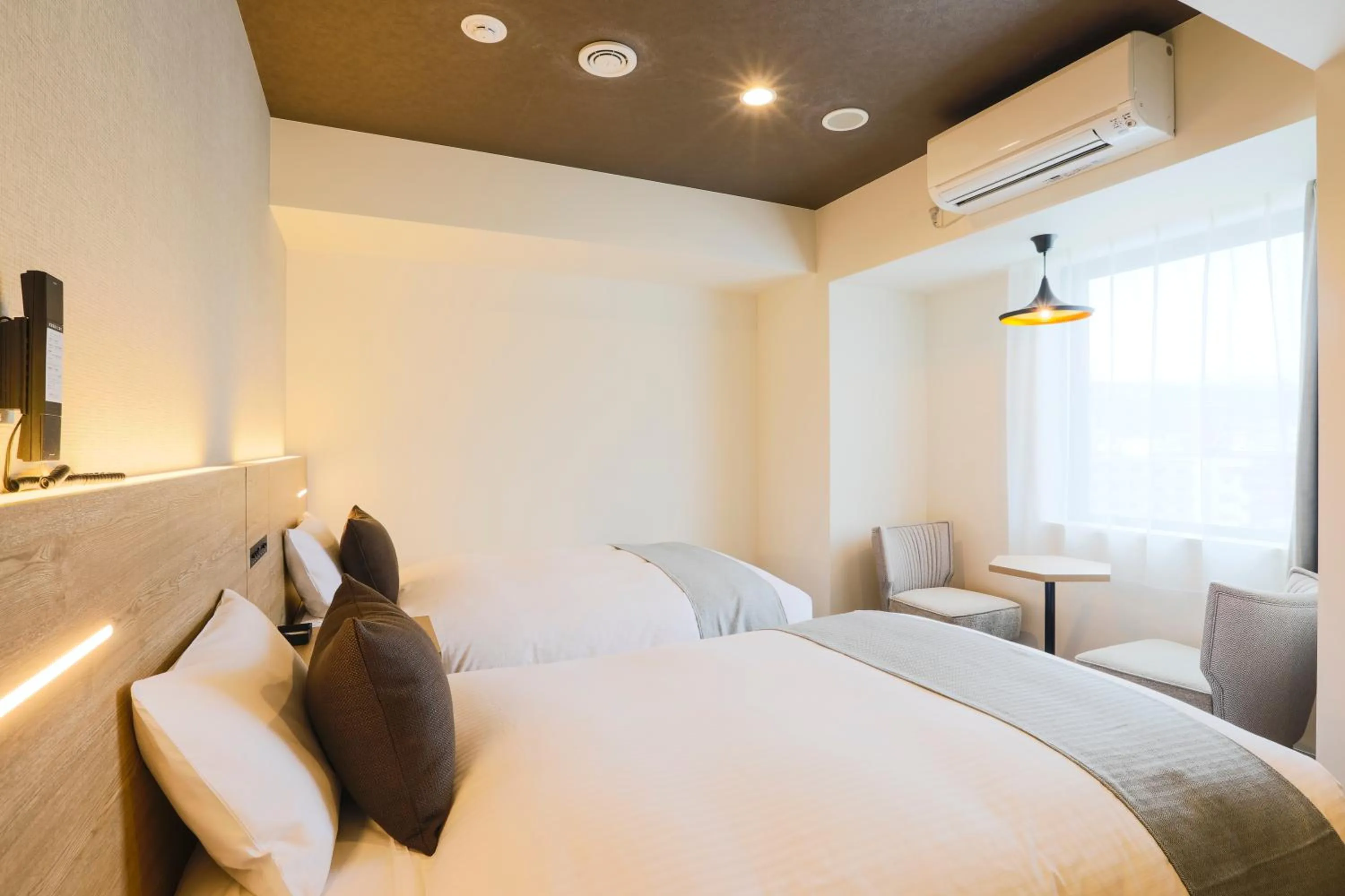 Photo of the whole room, Bed in KOKO HOTEL Sapporo Susukino - formerly Hotel Wing International Sapporo Susukino