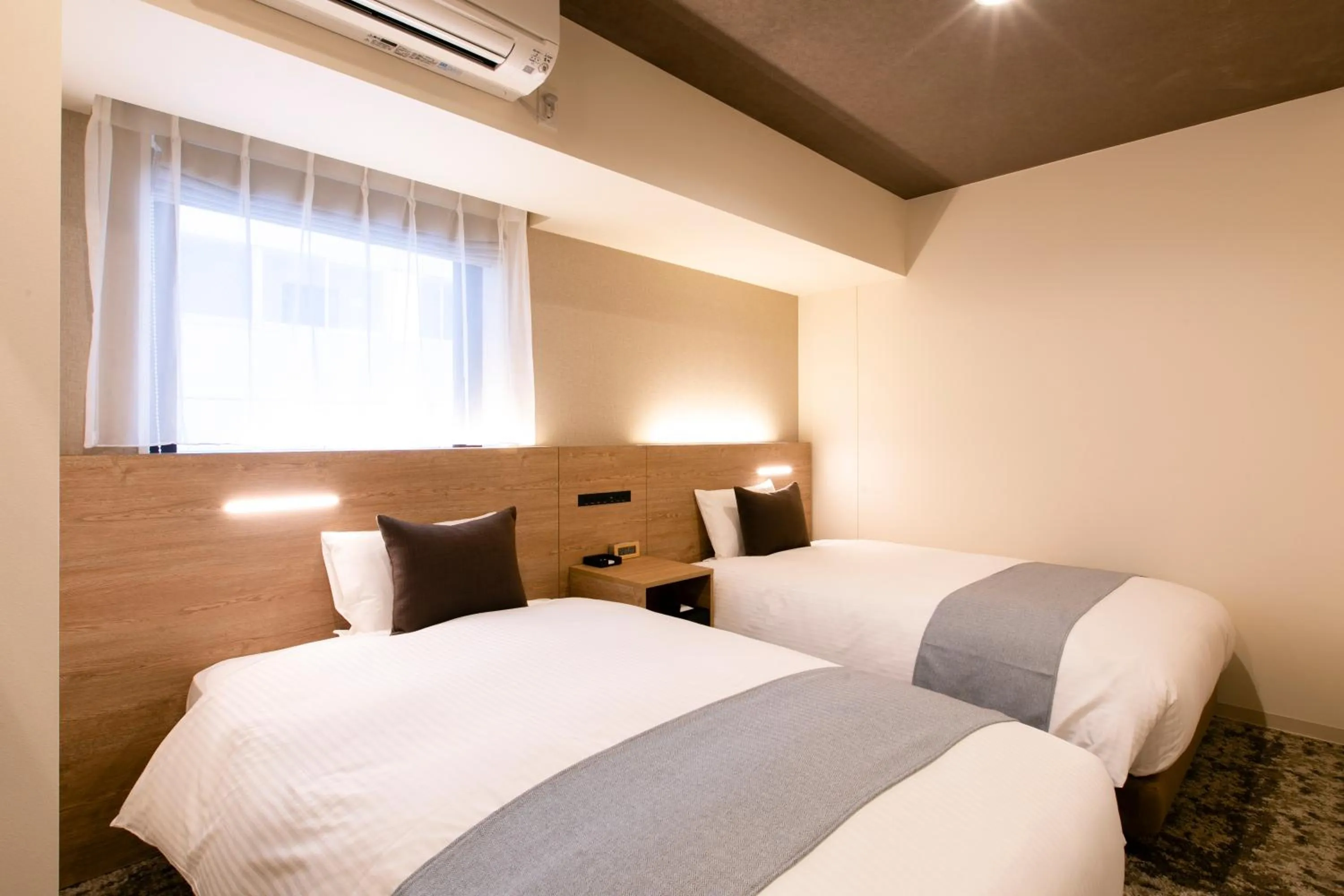 Photo of the whole room, Bed in KOKO HOTEL Sapporo Susukino - formerly Hotel Wing International Sapporo Susukino