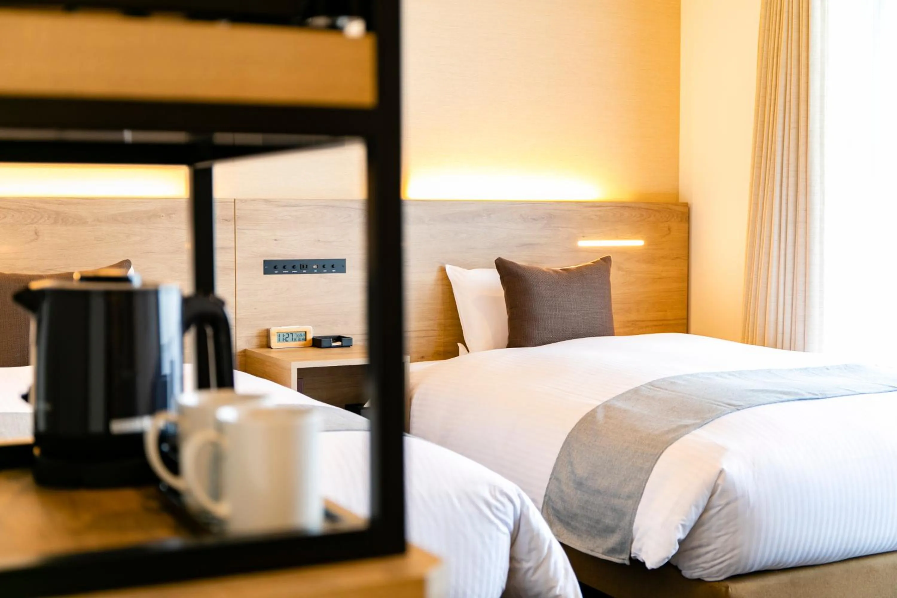 Photo of the whole room, Bed in KOKO HOTEL Sapporo Susukino - formerly Hotel Wing International Sapporo Susukino