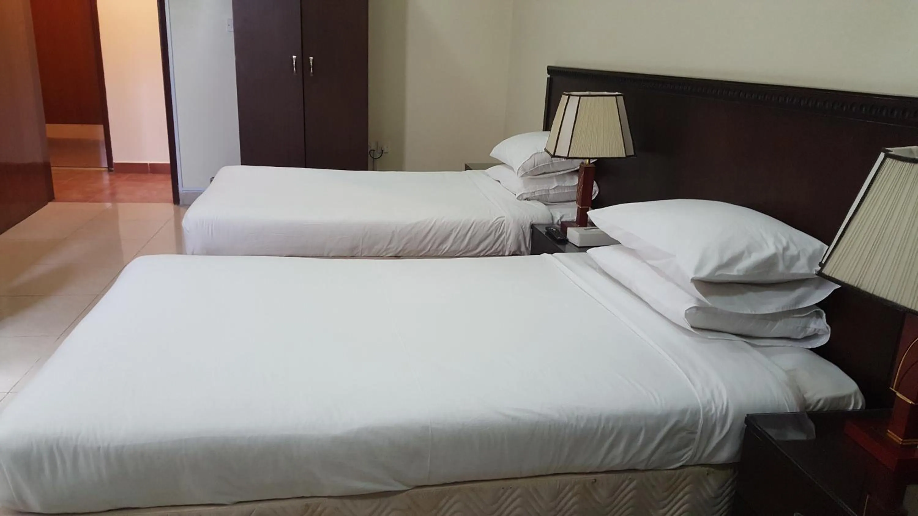 Bed in Al Muntazah Plaza Hotel