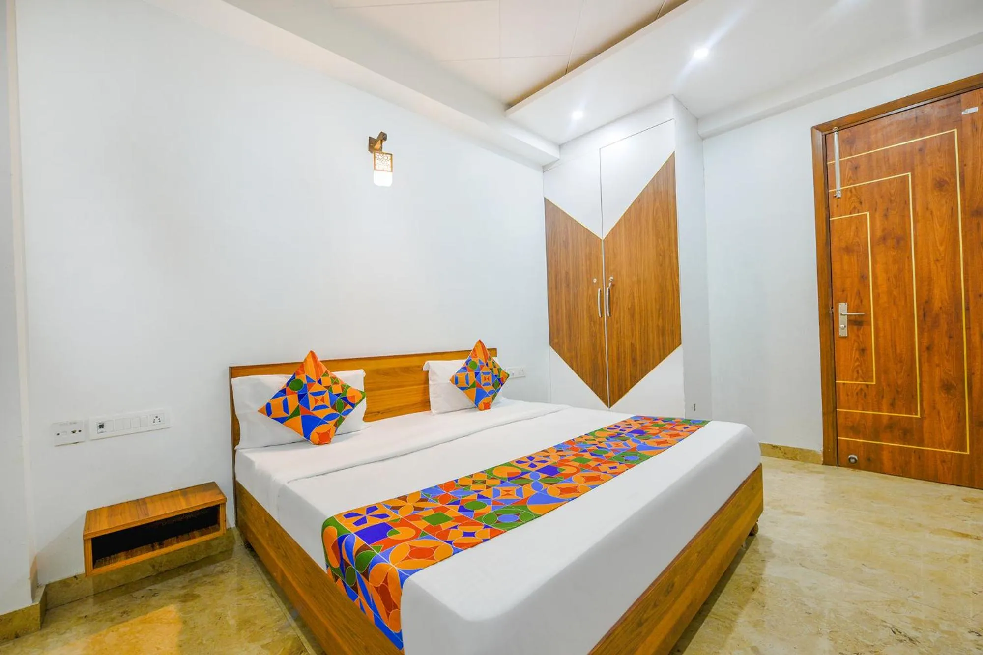Bed in FabHotel Amrit Residency