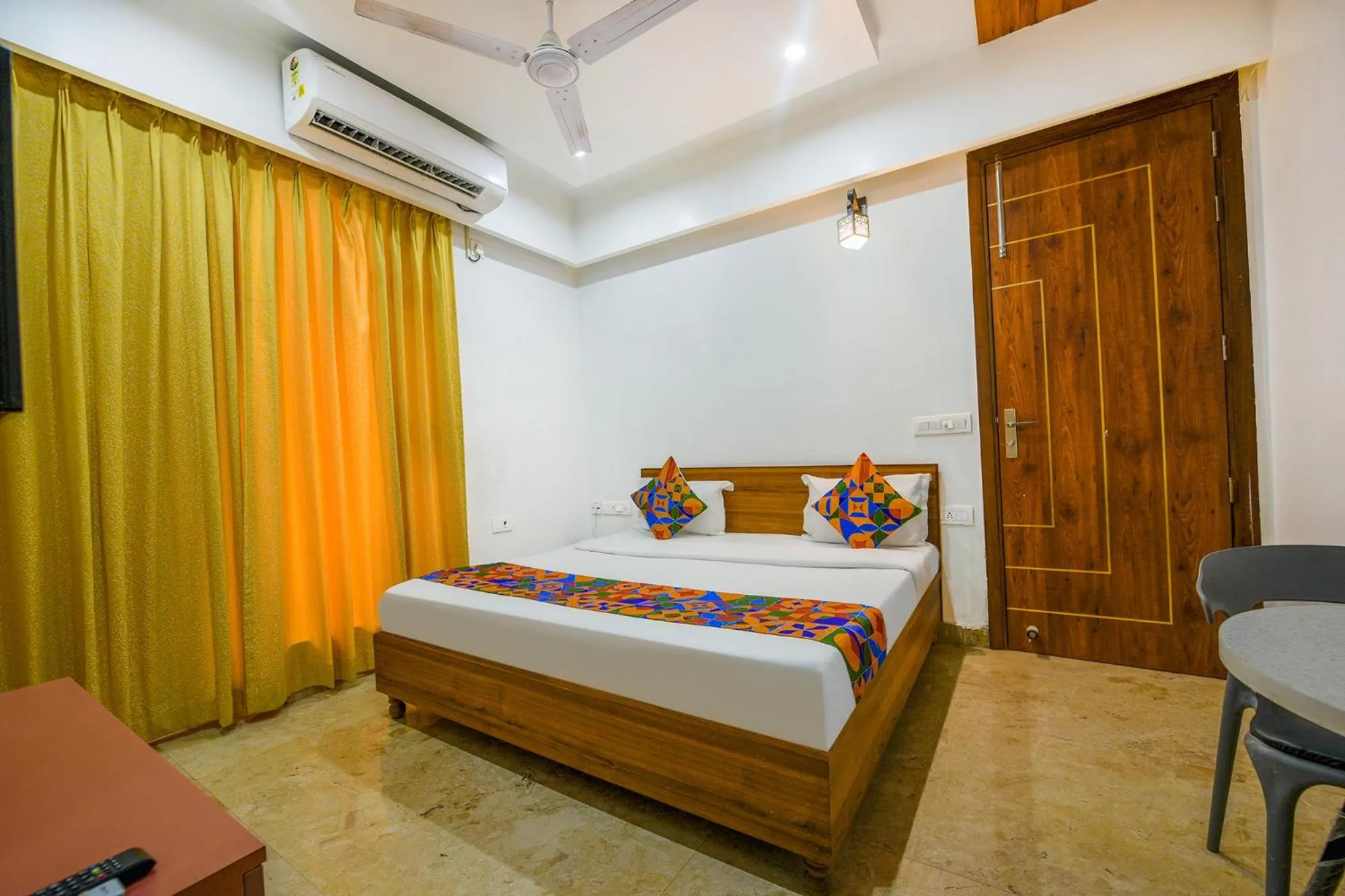 Bed in FabHotel Amrit Residency