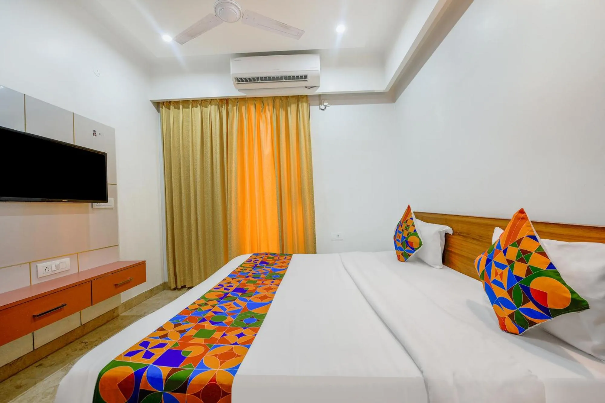 Bed in FabHotel Amrit Residency