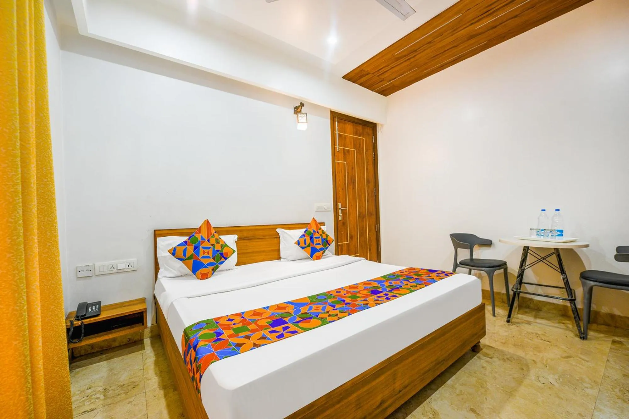 Bed in FabHotel Amrit Residency