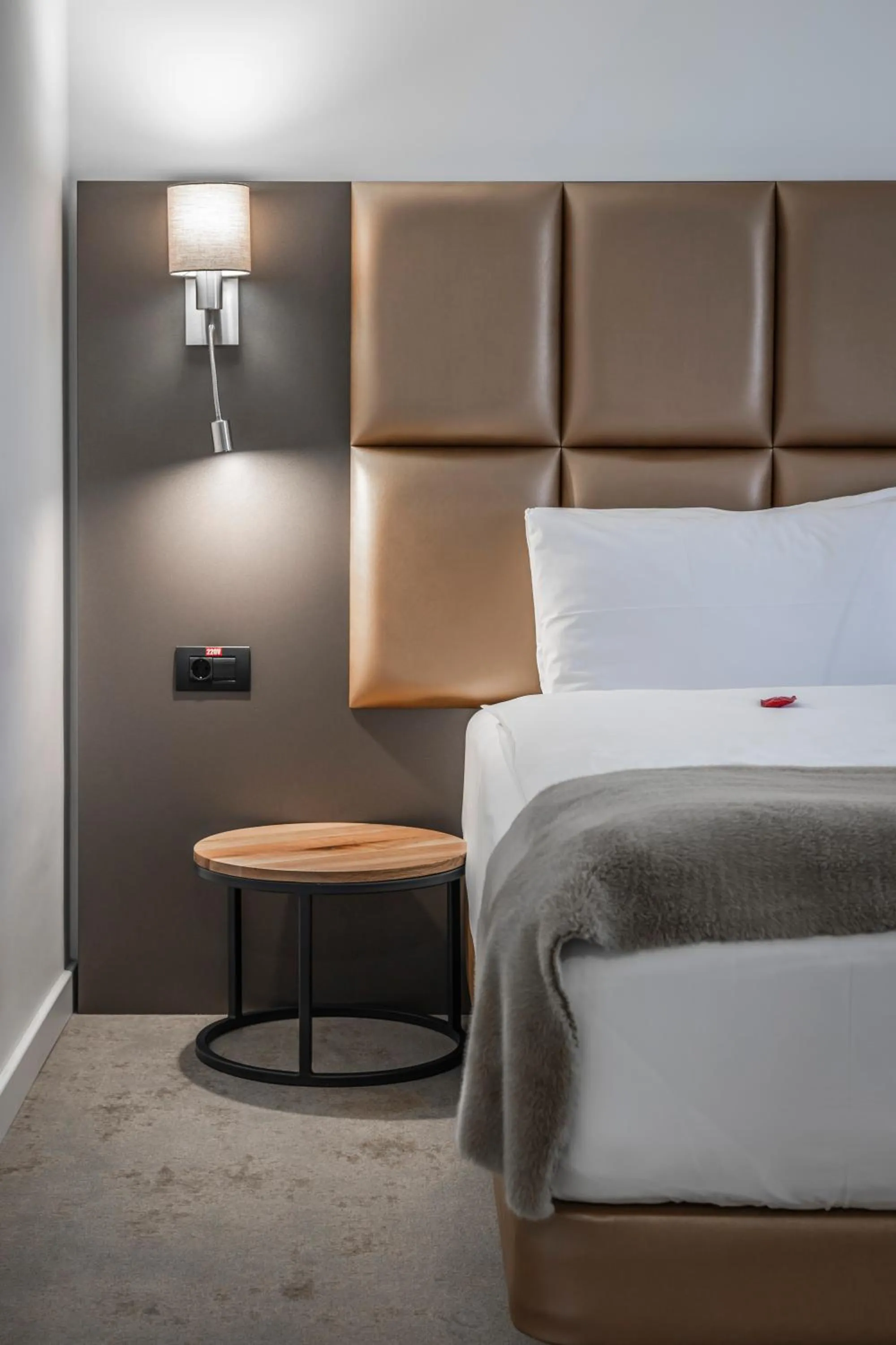 Bed in Charm Boutique Hotel