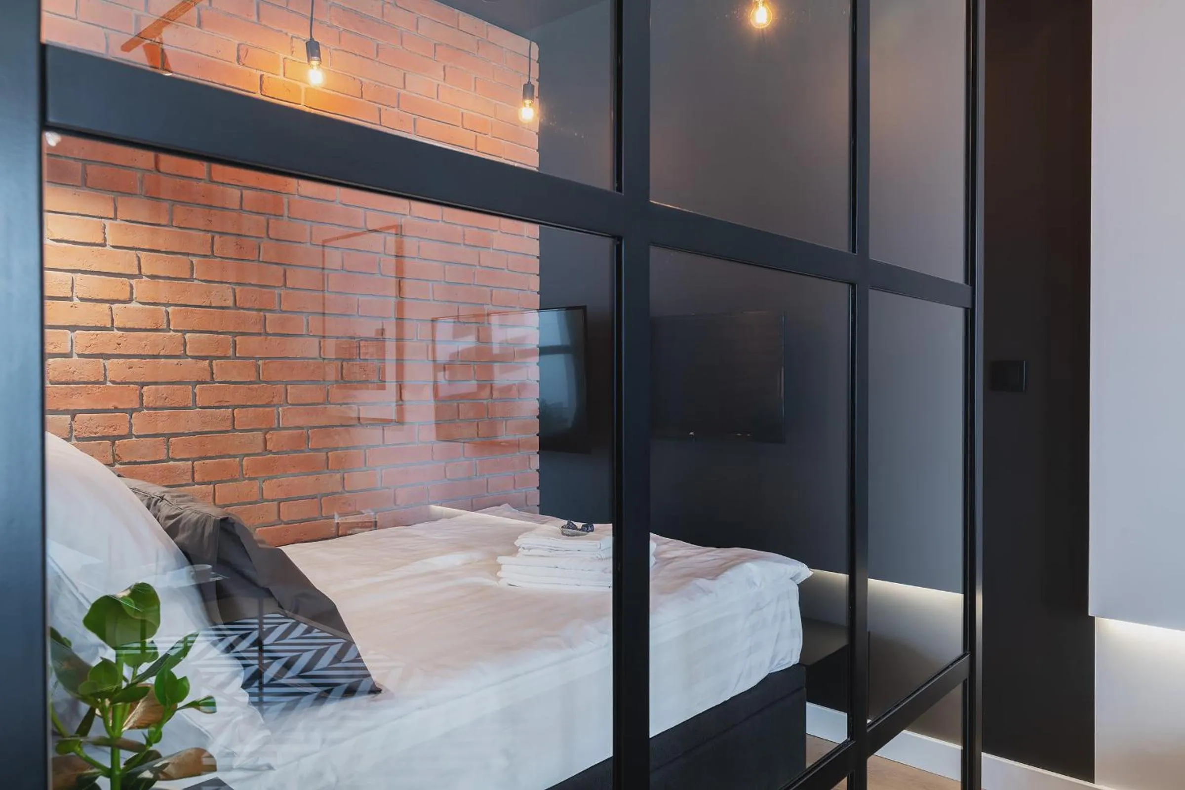 Bed in YourSecondFlat Grzybowska