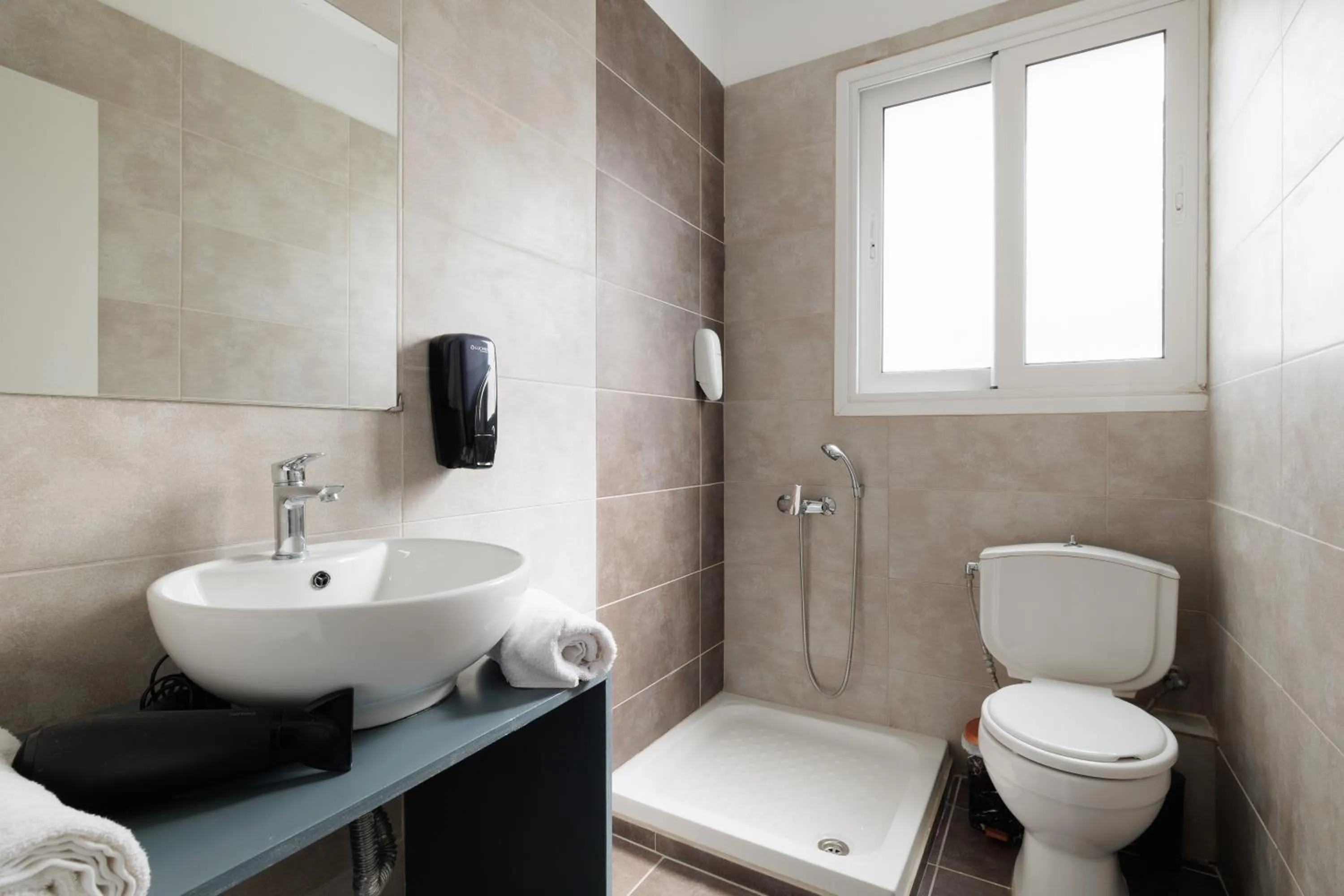 Shower in Local Hostel & Suites