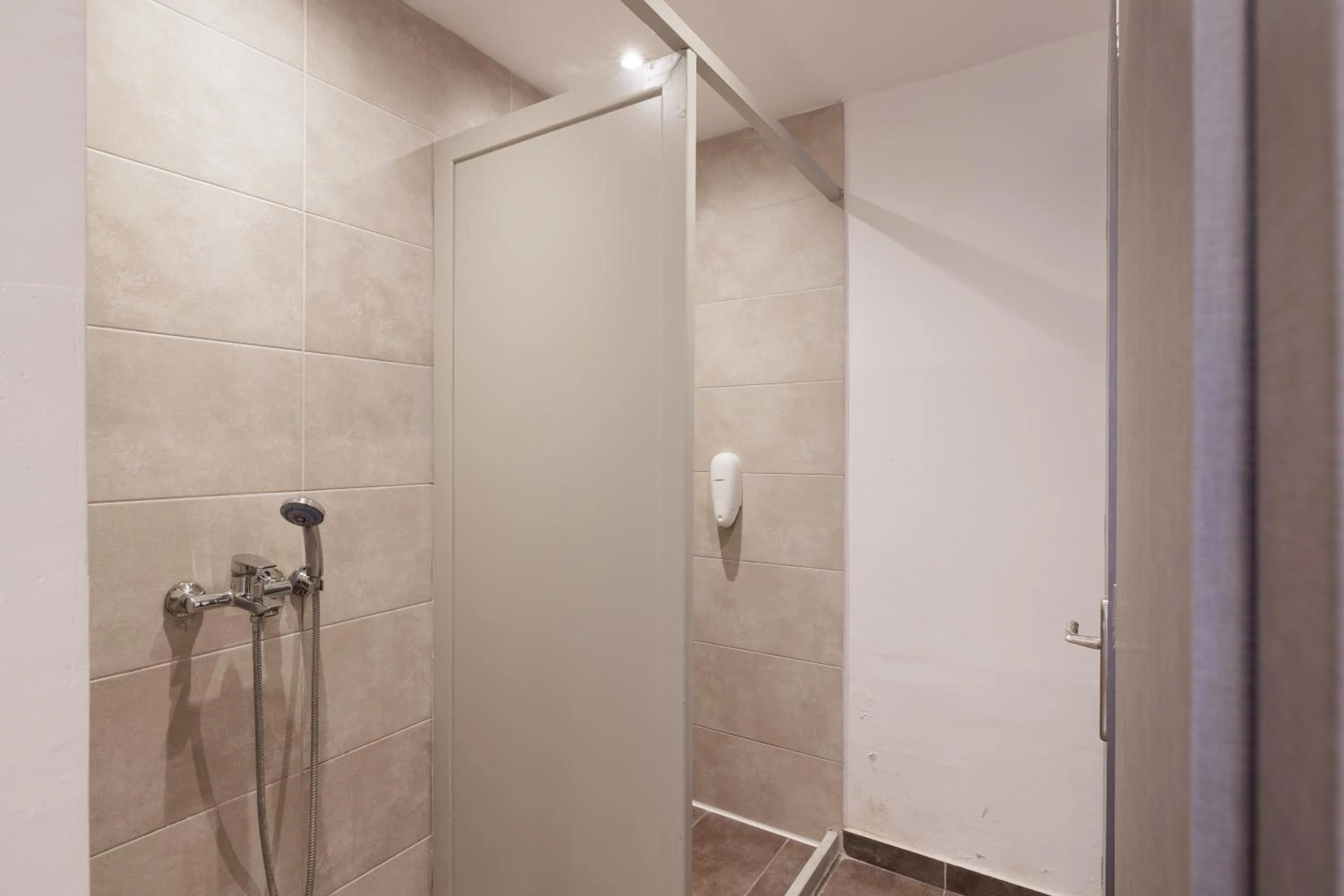 Shower in Local Hostel & Suites