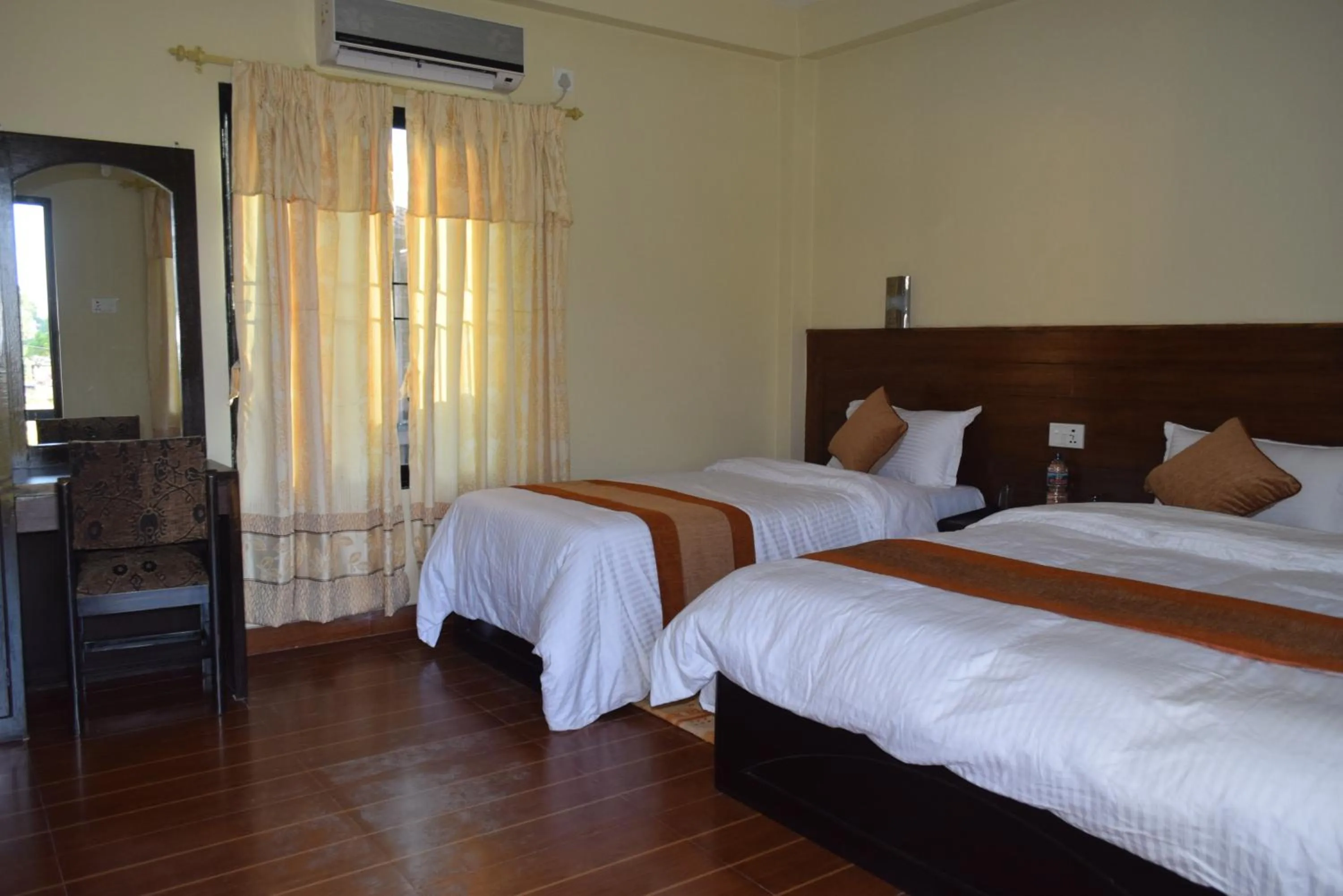 Photo of the whole room, Bed in Chitwan Village Resort