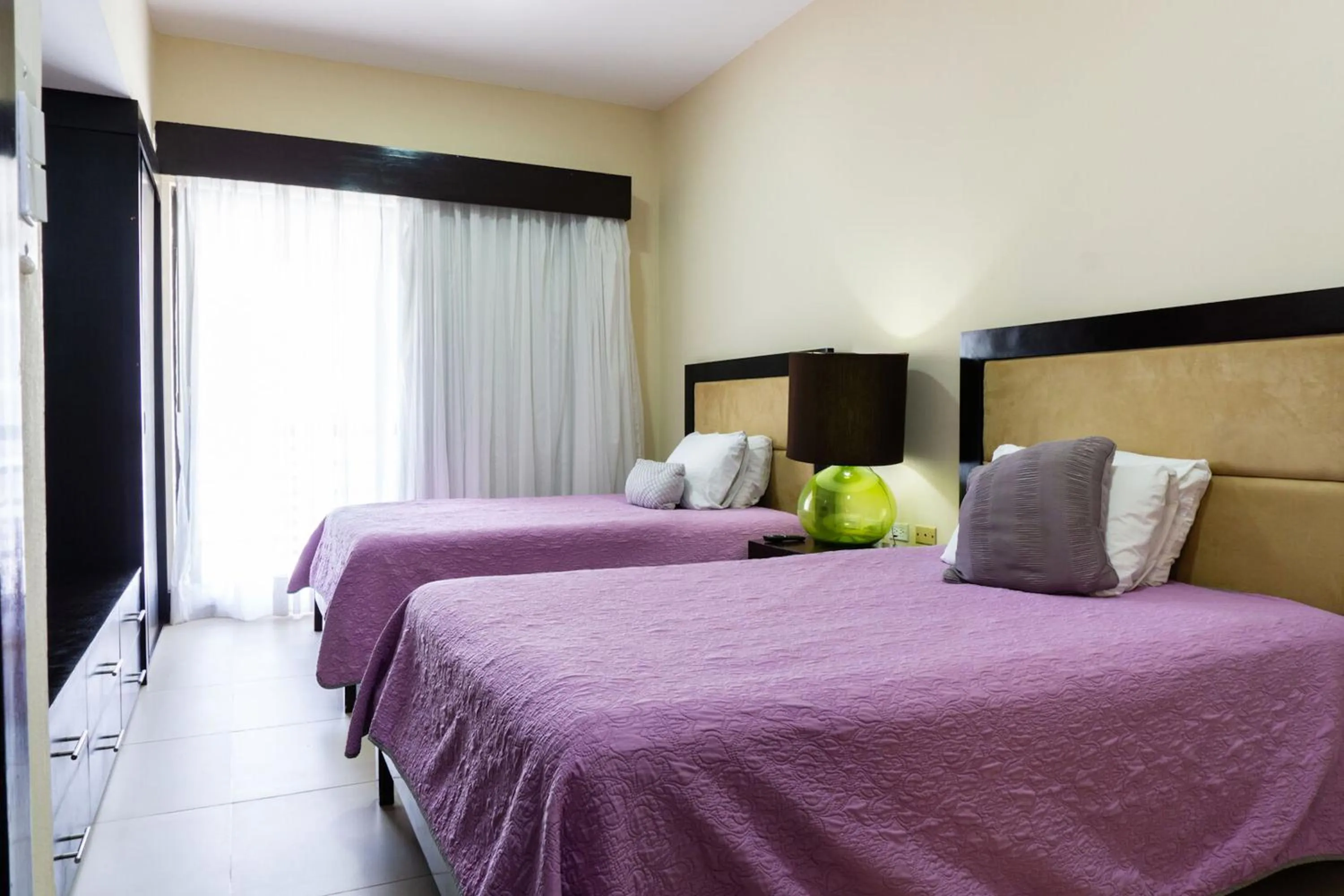 Bed in Aldea Beachside Condo by BVR