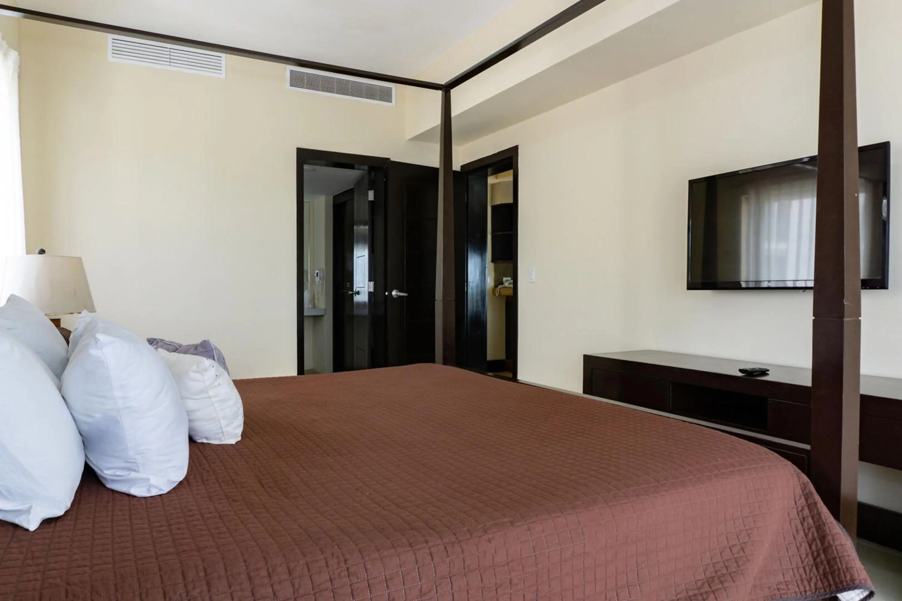 Bed in Aldea Beachside Condo by BVR