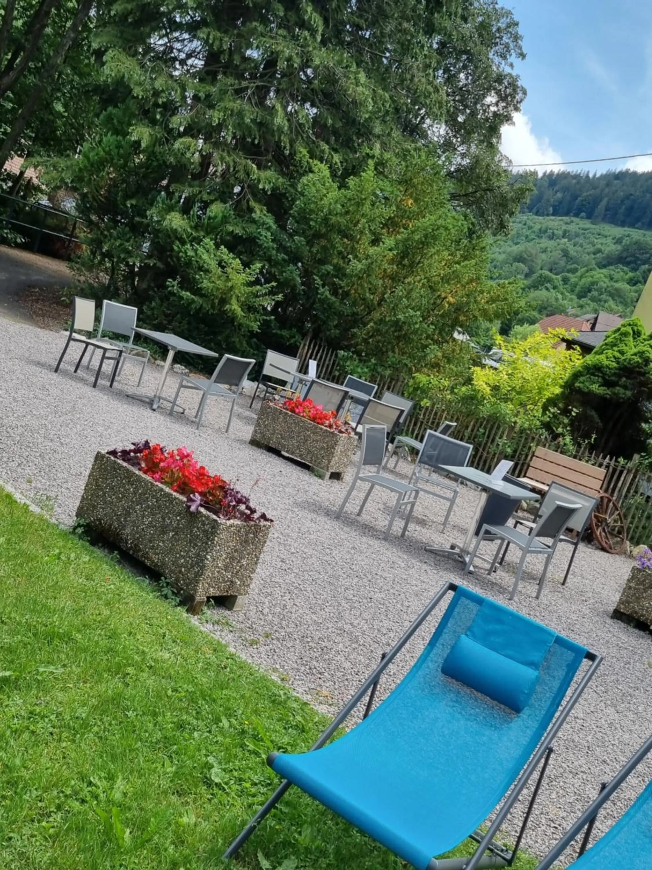 Patio in Logis Hôtel Restaurant De La Poste et SPA de Montagne
