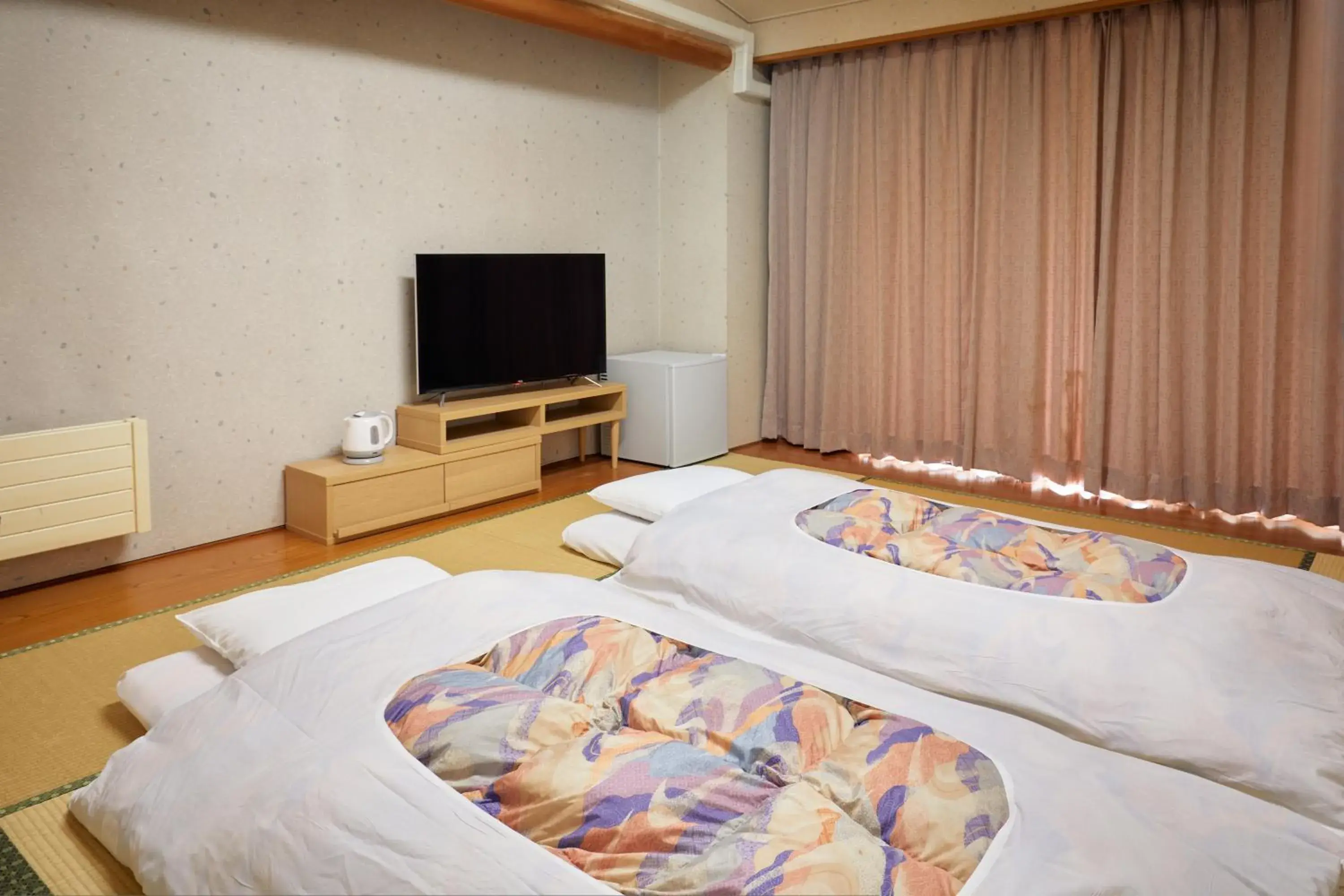 Bed in IKOI Villa Bed in IKOI Villa