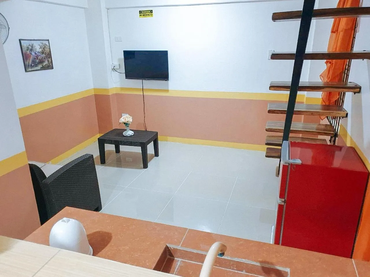 Bed, TV/Entertainment Center in RedDoorz near SGM Condotel Villa Beach Iloilo