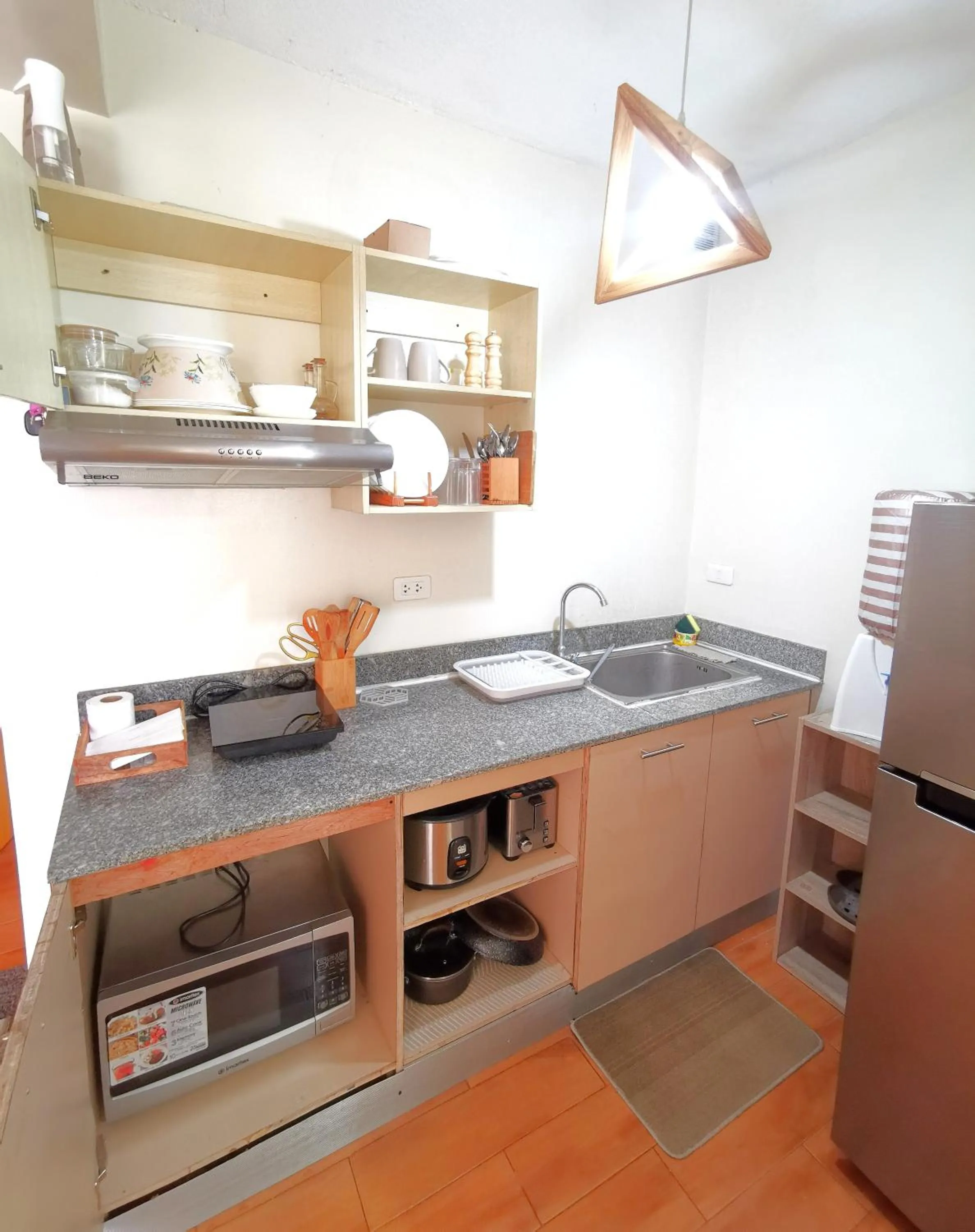 Kitchen or kitchenette in Davao Condo 2BR Pool Wifi Netflix