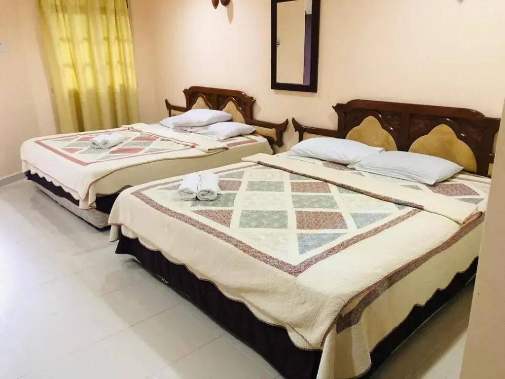 Bed in Penarak Bamboo Beach Motel Bed in Penarak Bamboo Beach Motel