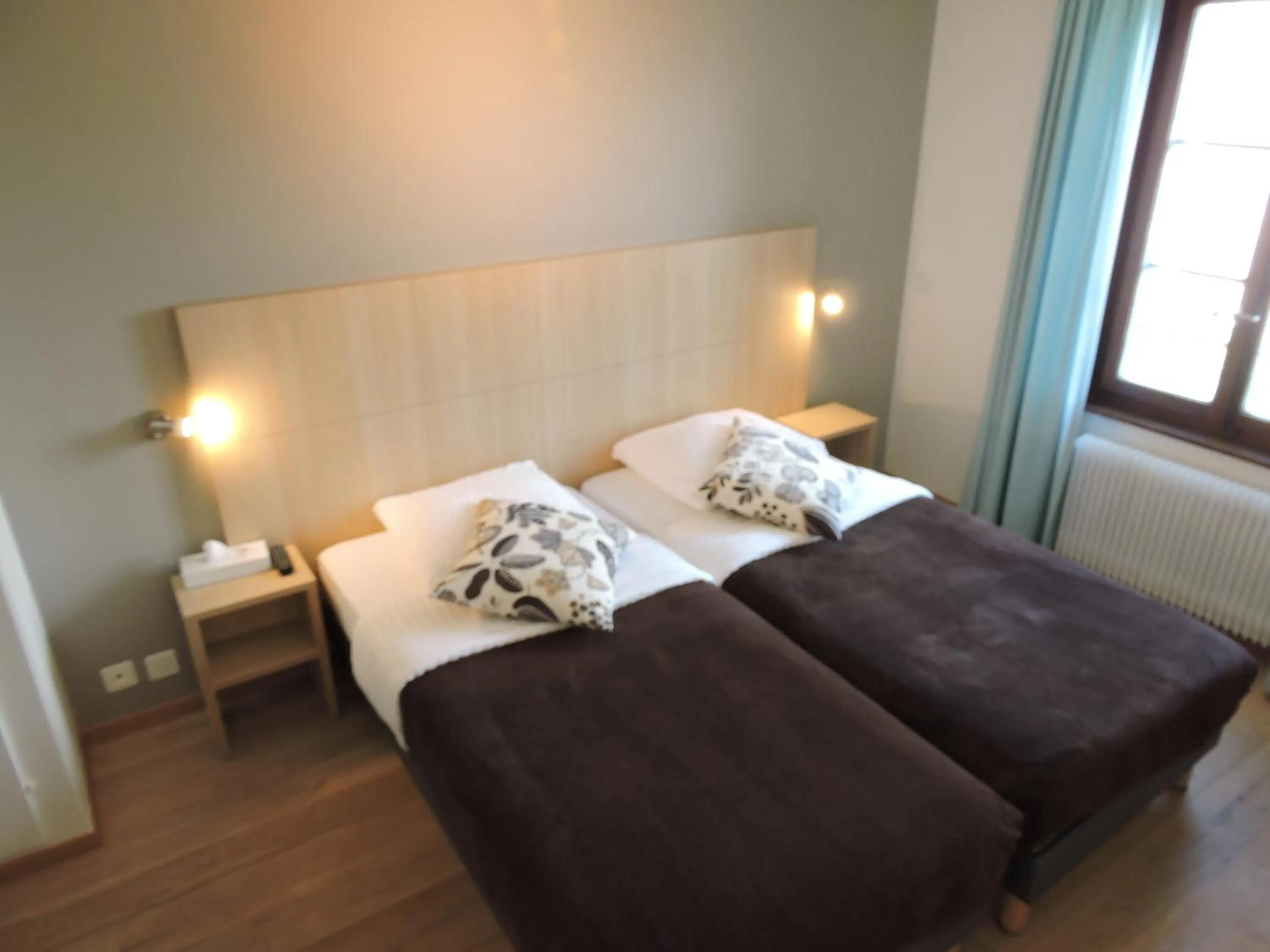 Photo of the whole room, Bed in Auberge Communale de St-Légier