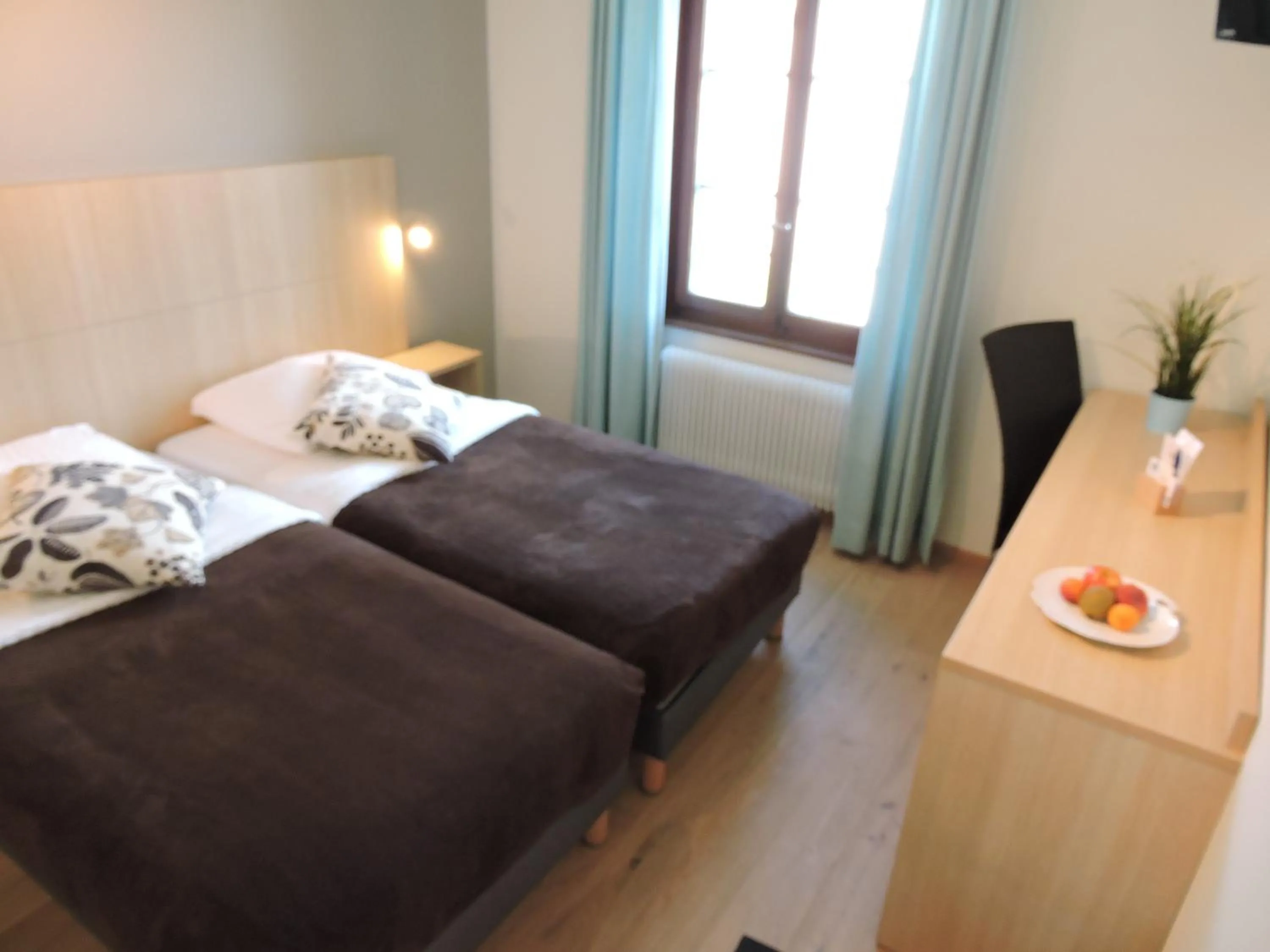Photo of the whole room, Bed in Auberge Communale de St-Légier