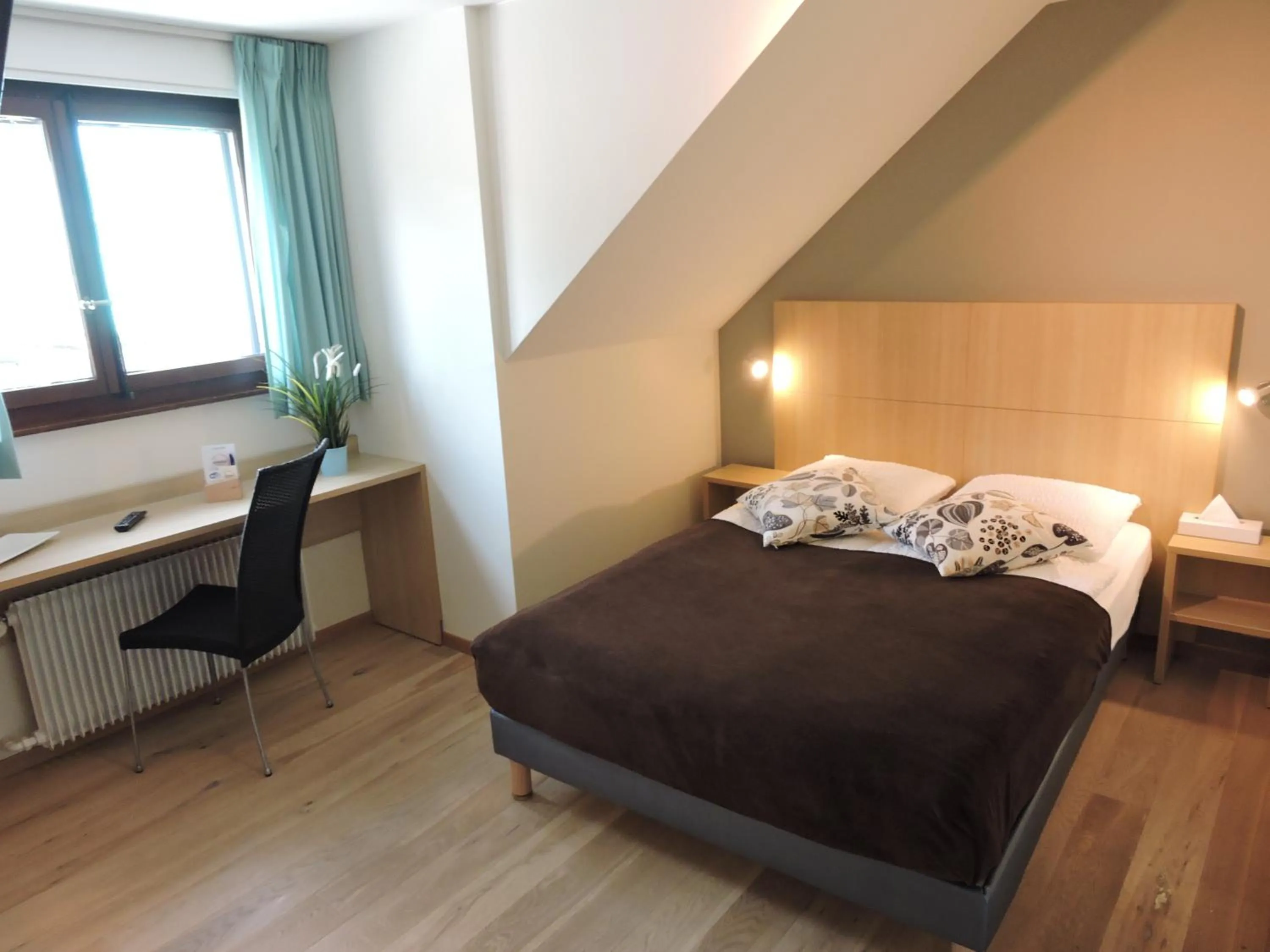 Photo of the whole room, Bed in Auberge Communale de St-Légier