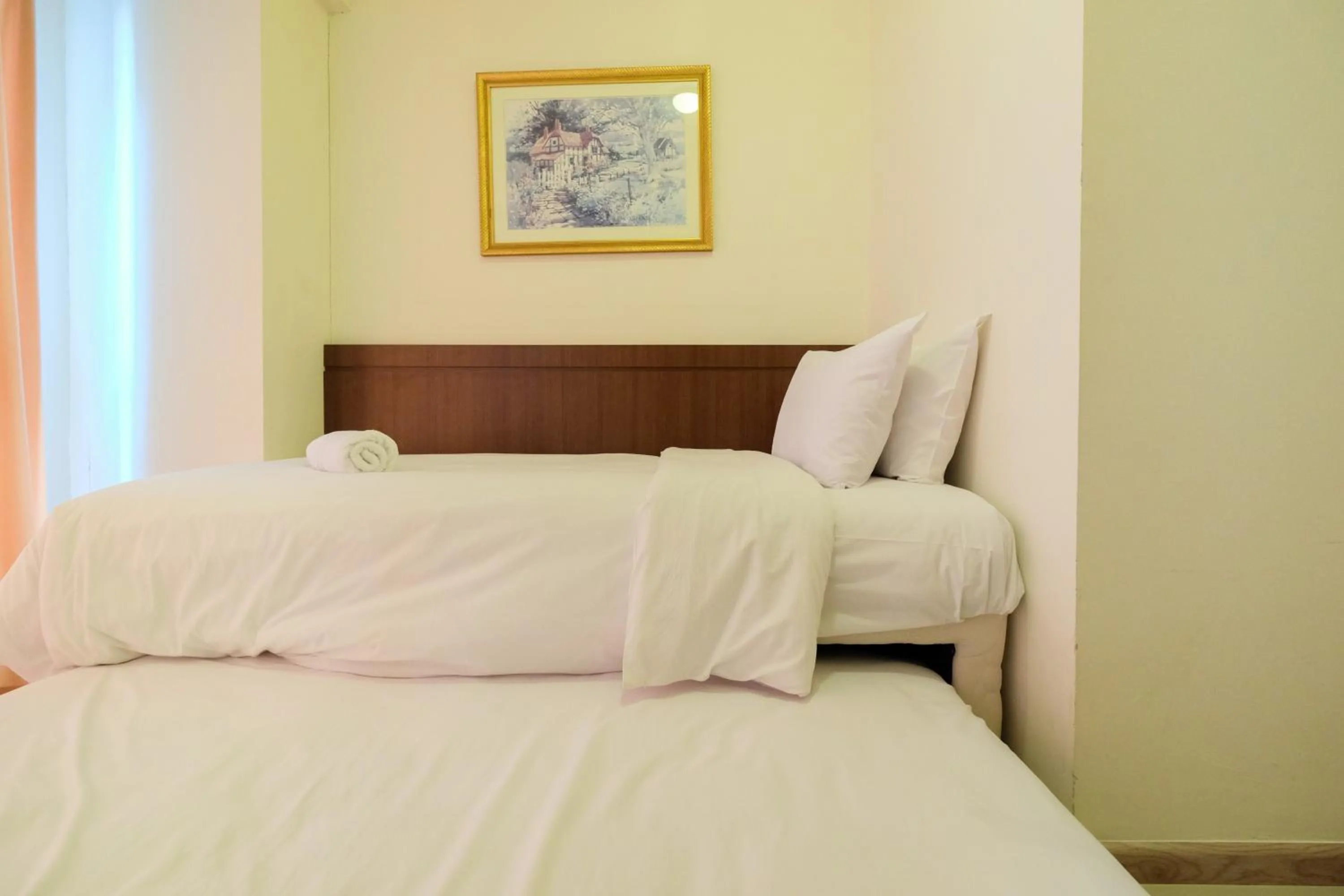 Bed in Homey 2BR Apartment at Casa Grande Residence By Travelio