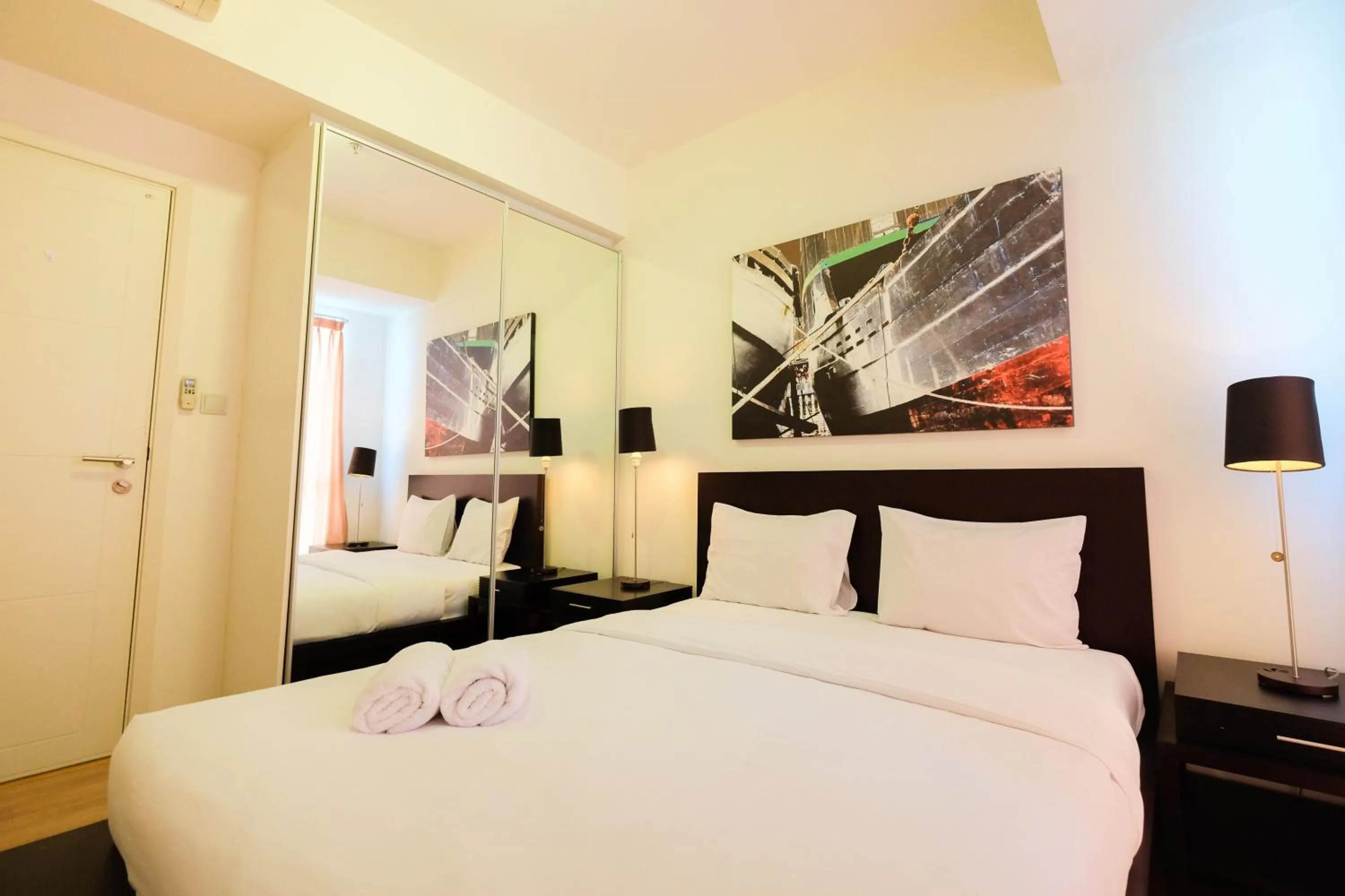 Bed in Homey 2BR Apartment at Casa Grande Residence By Travelio