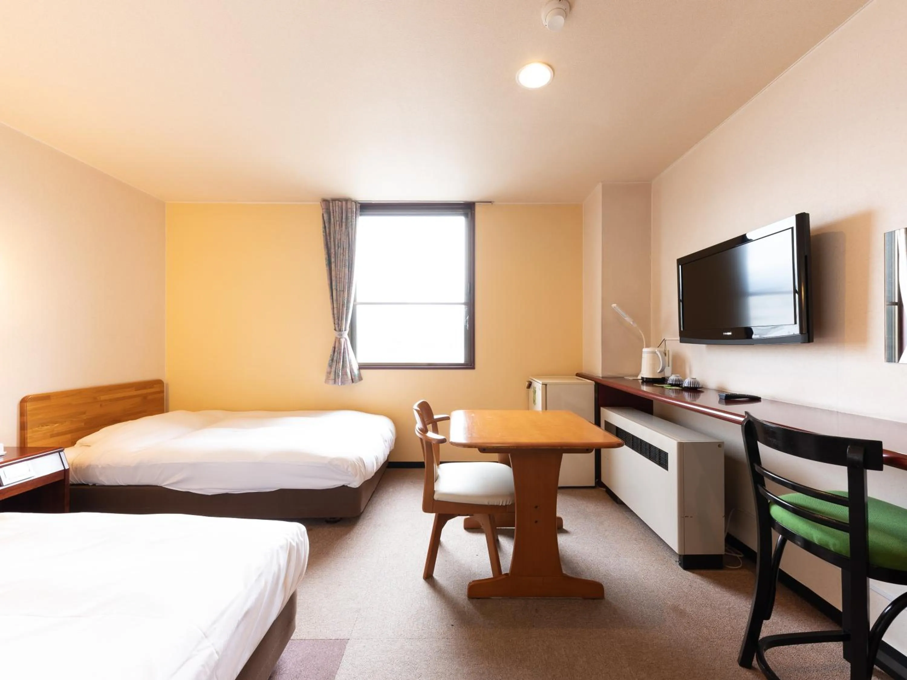 Bed in Tabist Travel Inn Shinshu Nakano