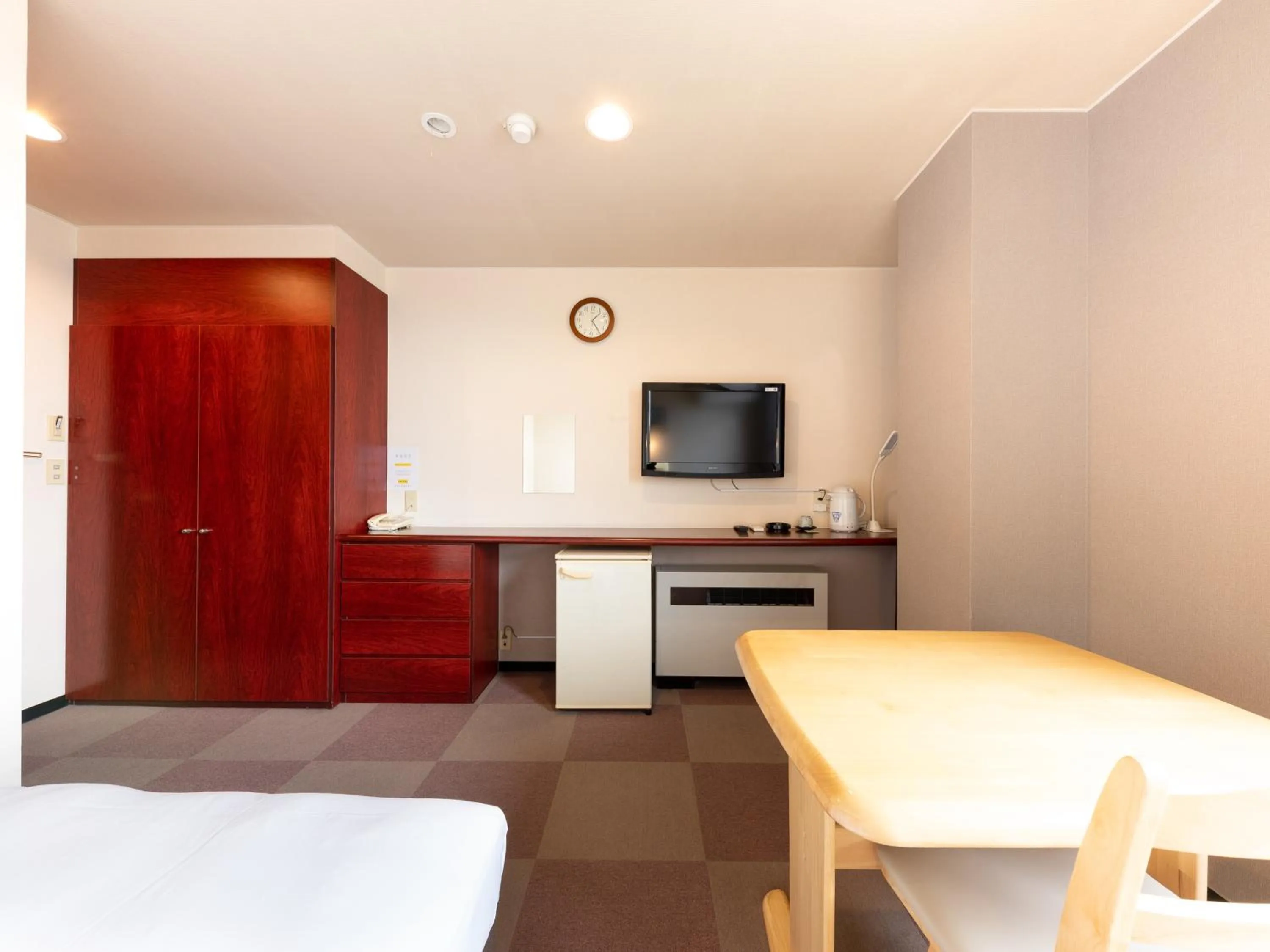 Bed in Tabist Travel Inn Shinshu Nakano