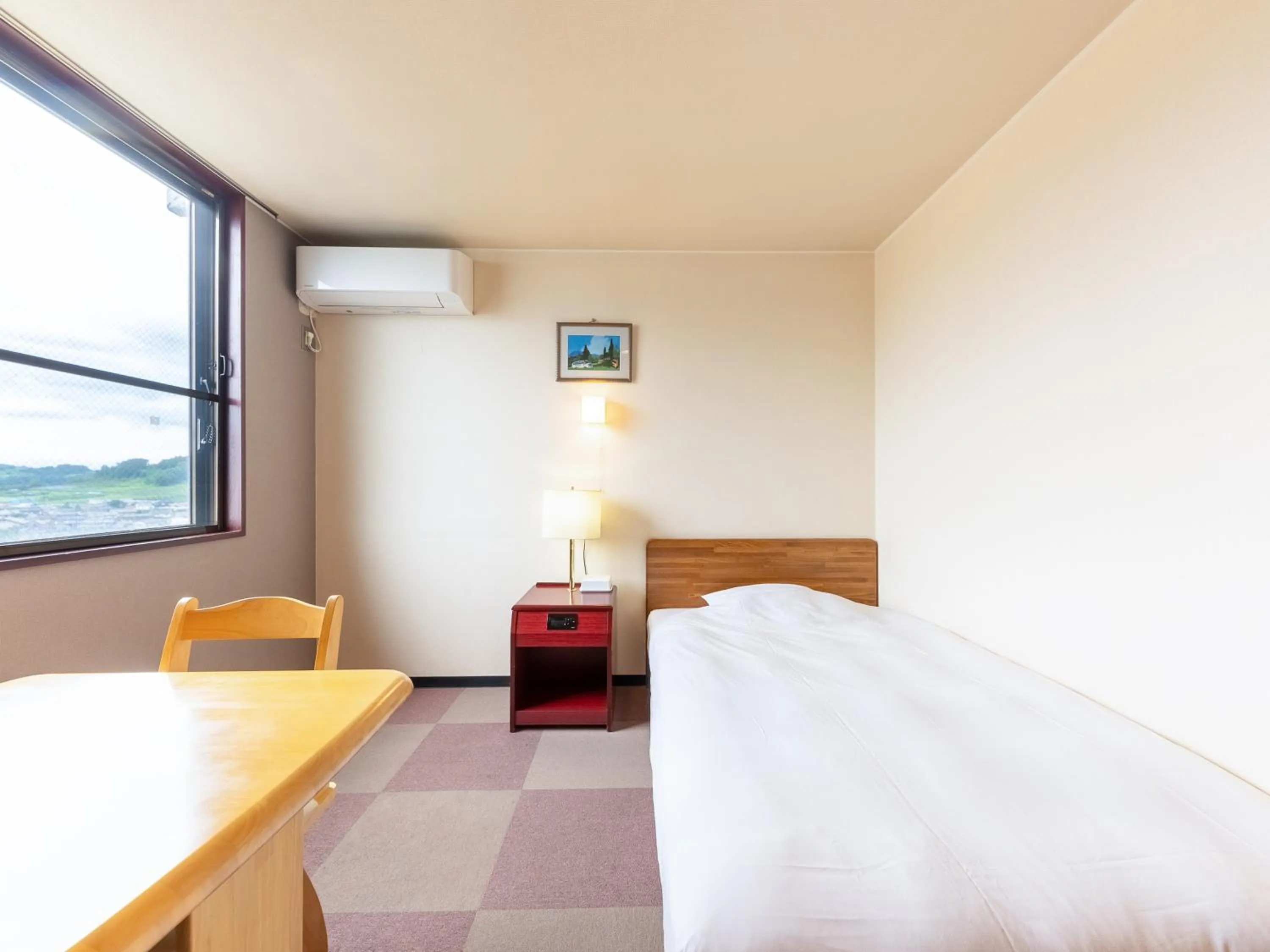 Bed in Tabist Travel Inn Shinshu Nakano