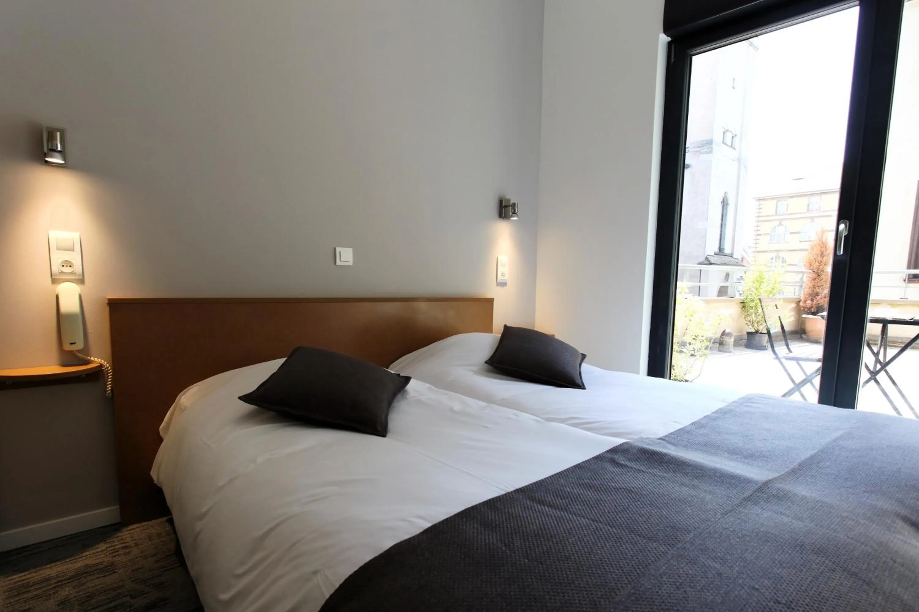 Bed in Hôtel De L'Ill