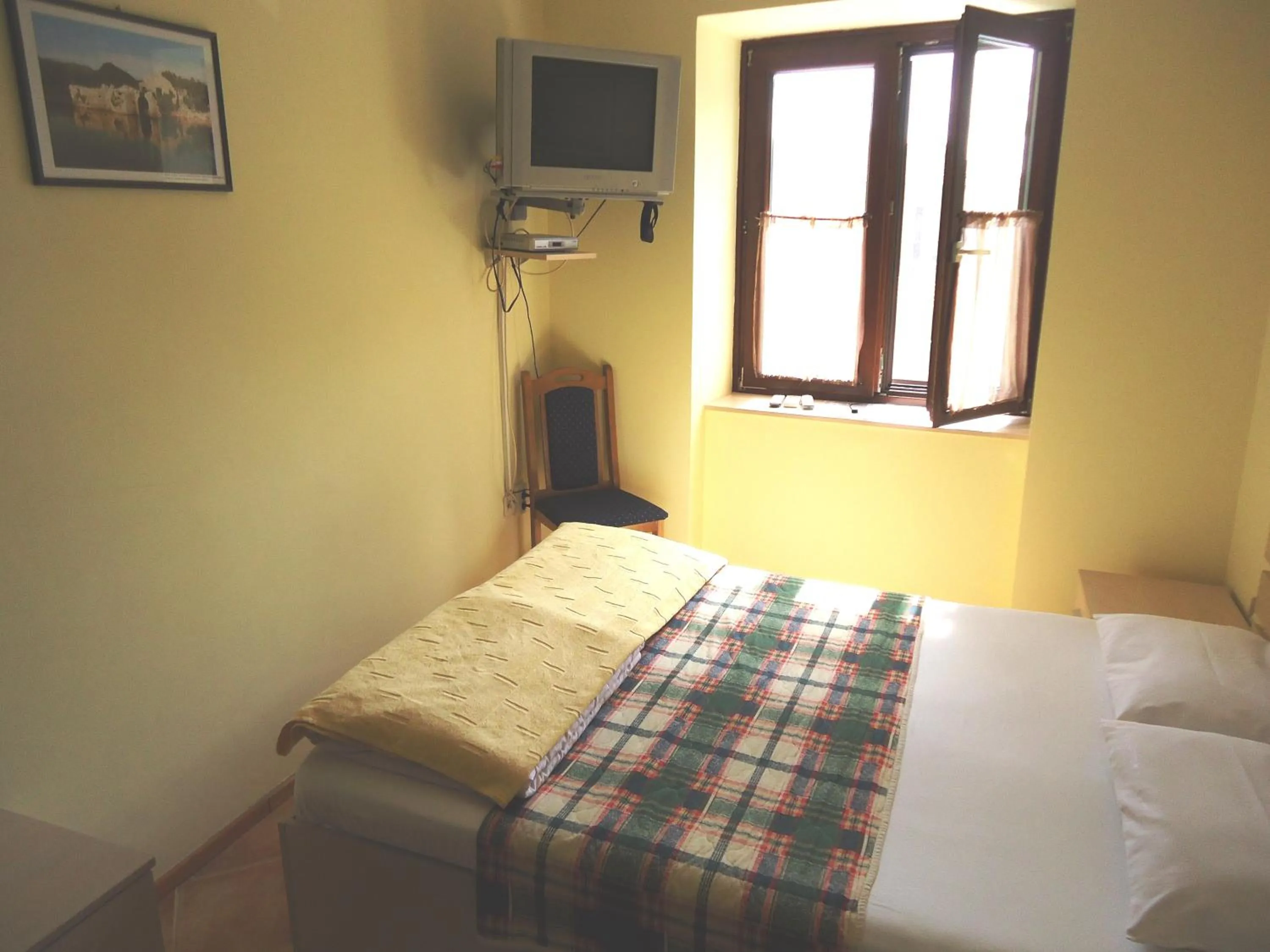 Bed in Hotel Pelikan