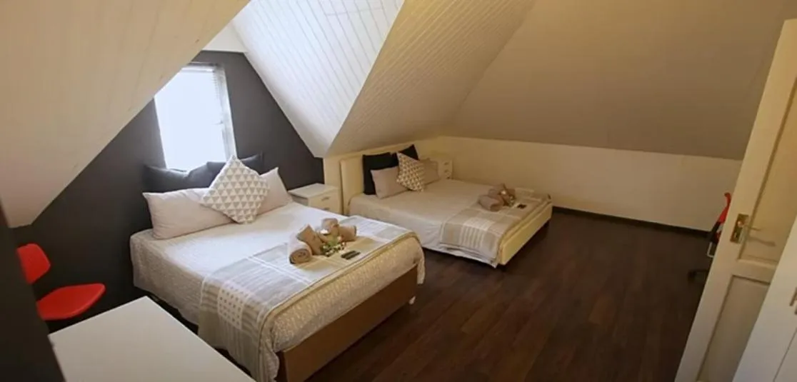 Bed in B&B Sauvignon Country Lodge