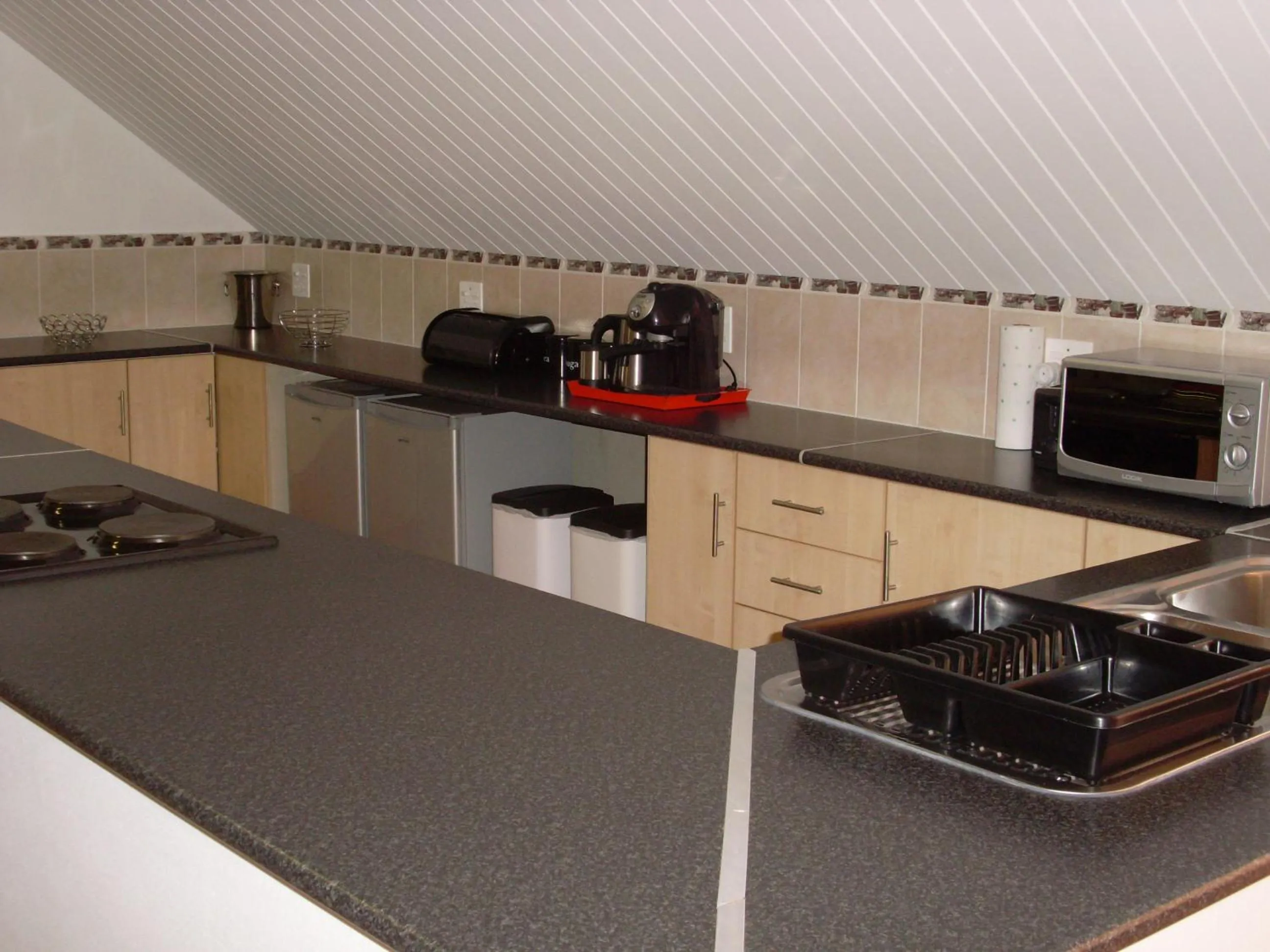 Kitchen or kitchenette in B&B Sauvignon Country Lodge