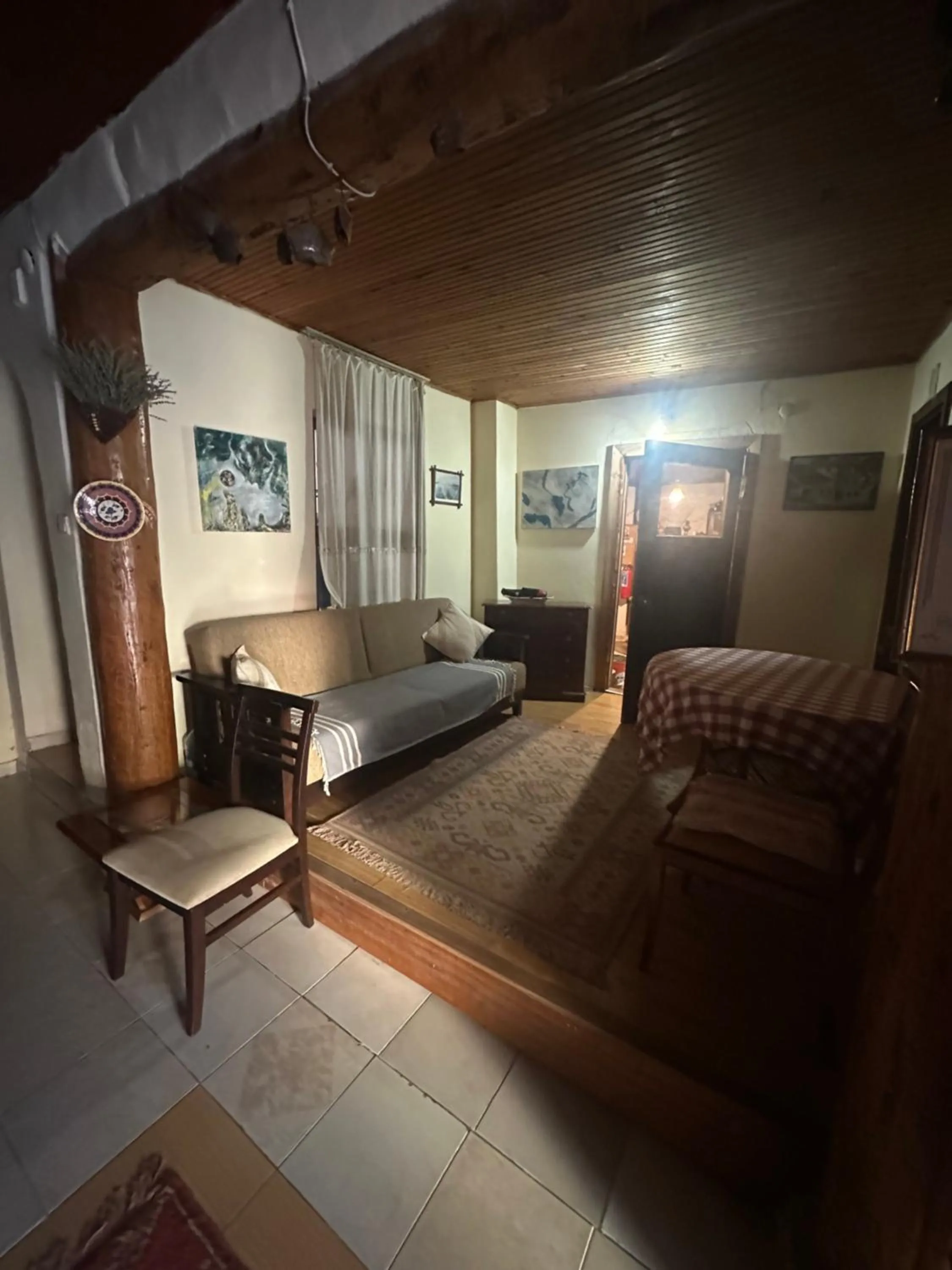 Seating area, Bed in Kont Pension